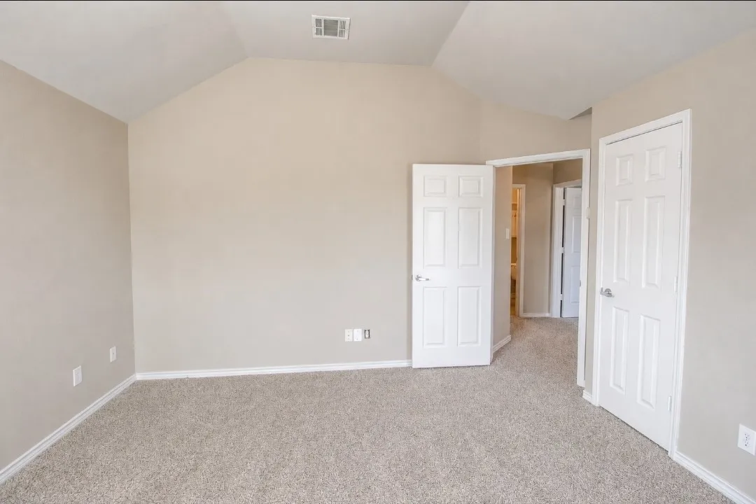 Vaulted ceiling accentuates the room's height