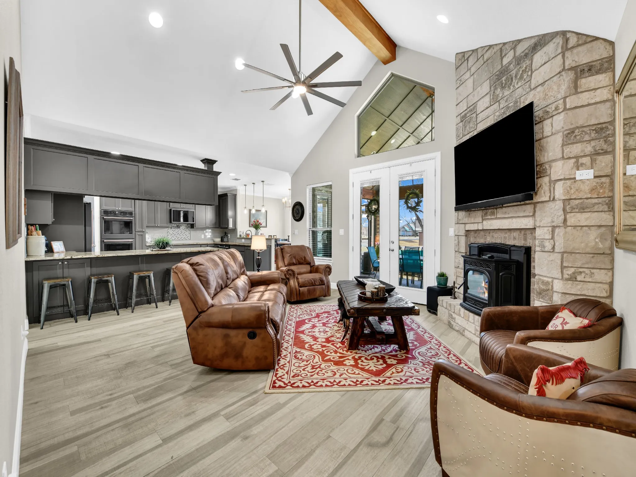 Living room with beam and fireplace