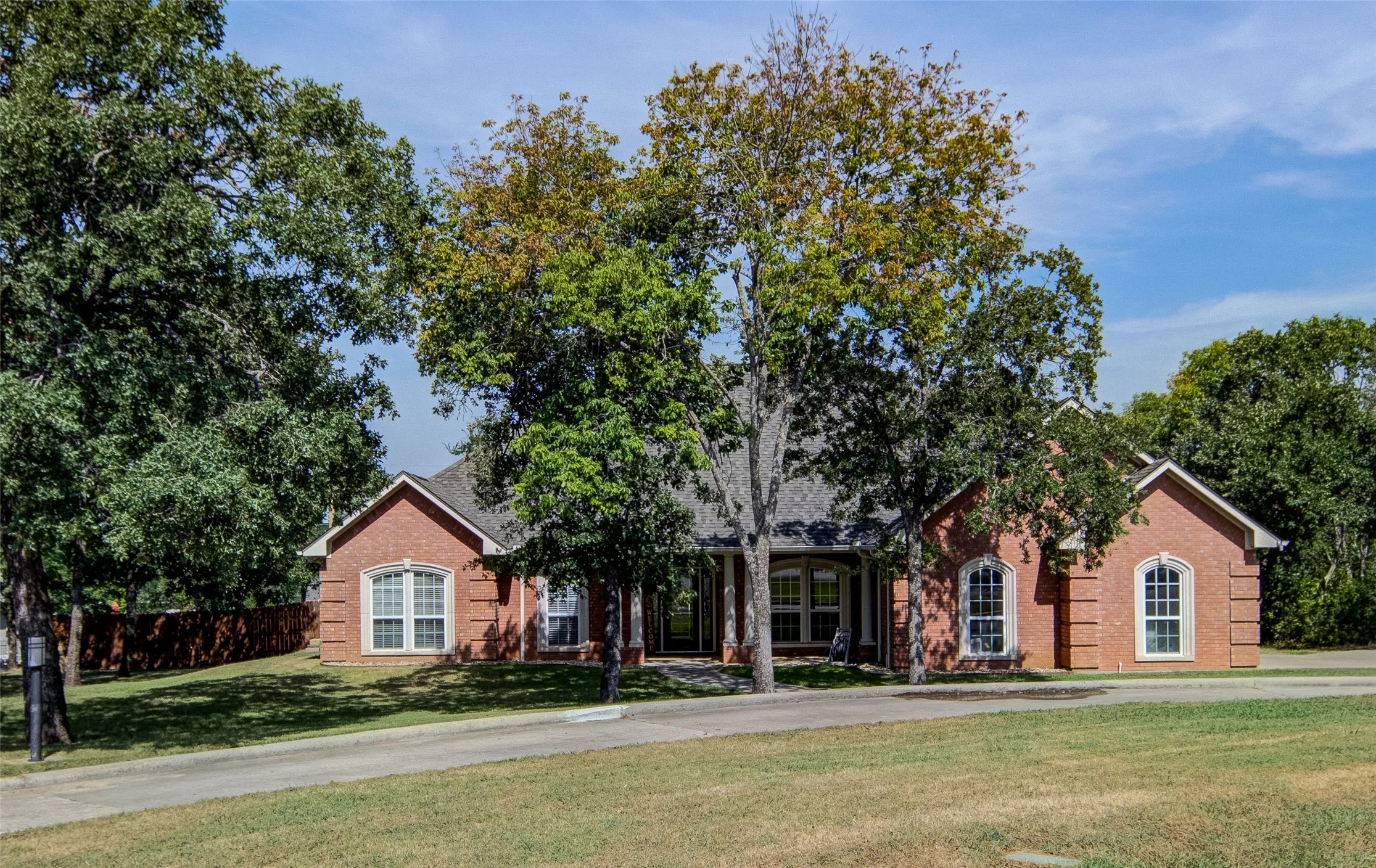 Brick exterior with a gabled roof and arched windows