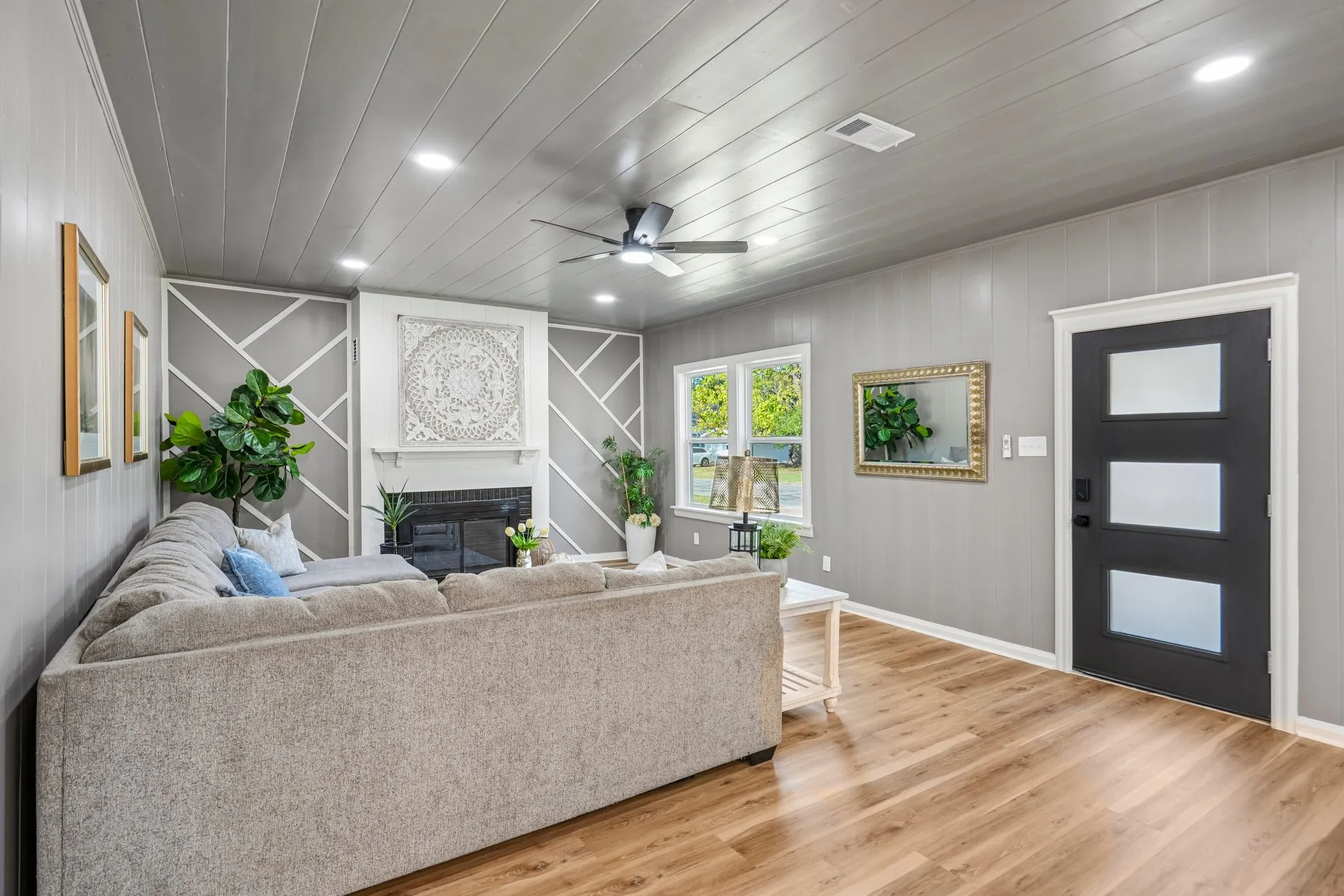 Wood-finish flooring, recessed lighting, and a ceiling fan