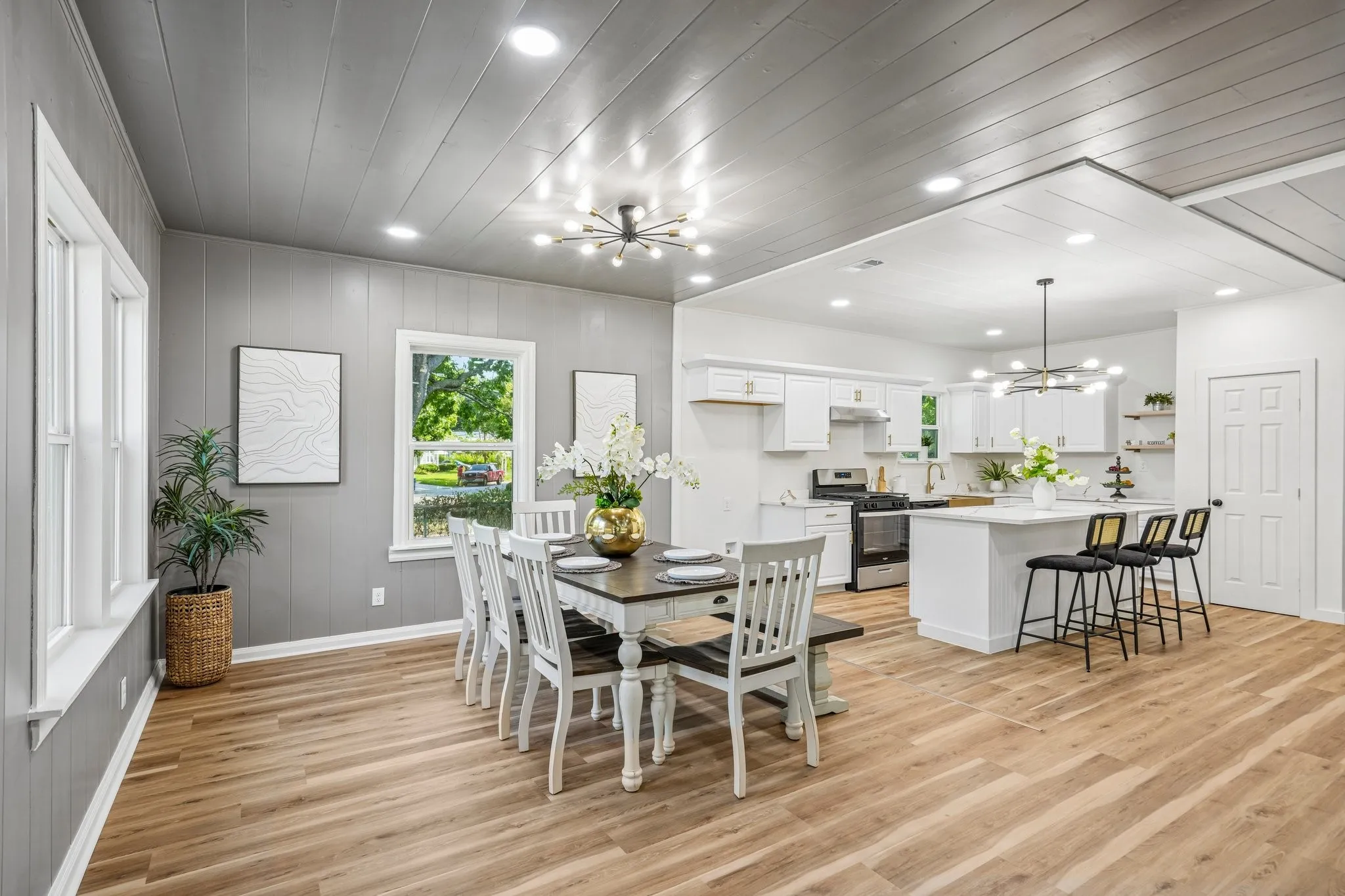 Open-concept living space with wood-finish flooring
