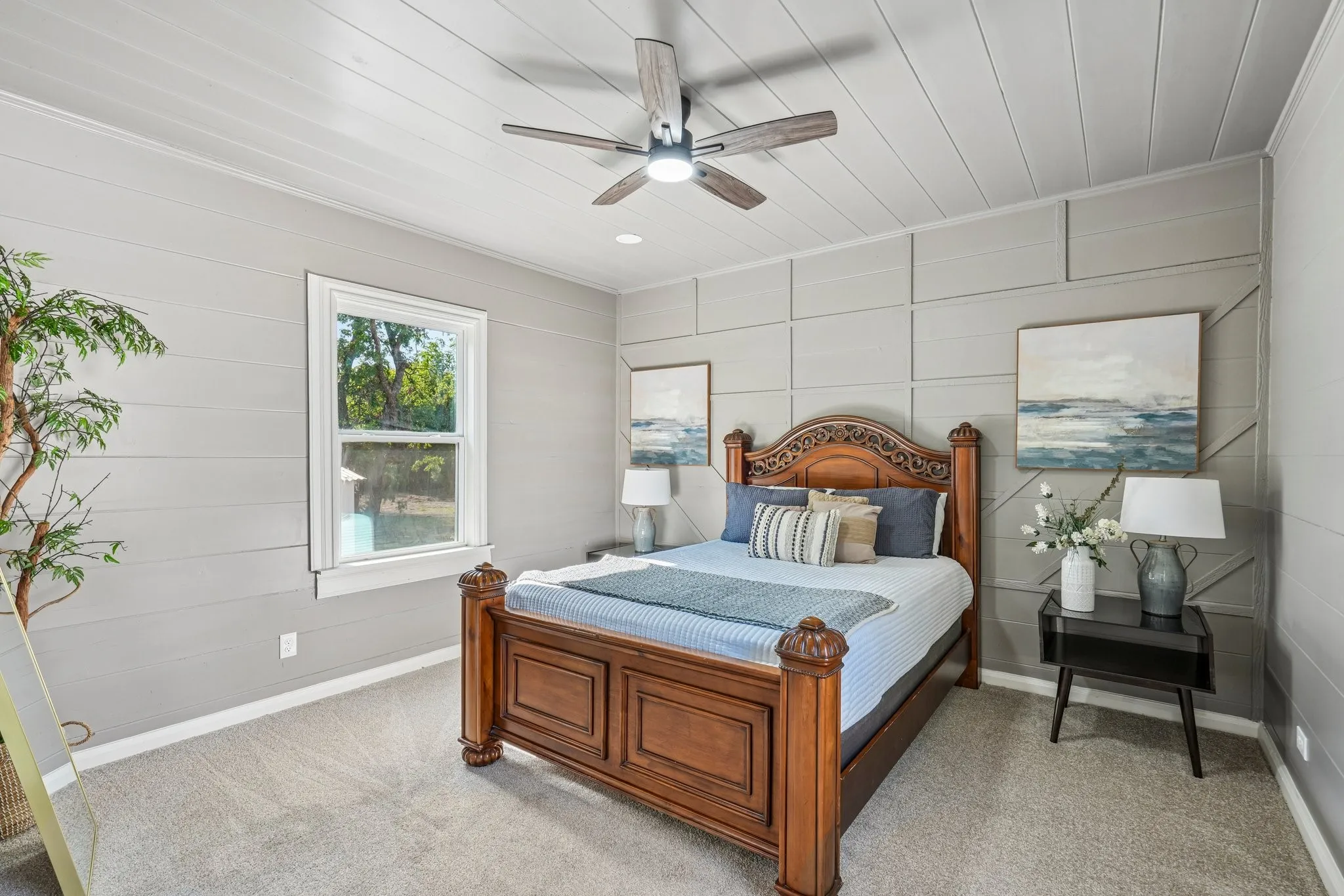 Carpeted flooring, paneled walls, ceiling fan, natural light window, and recessed lighting