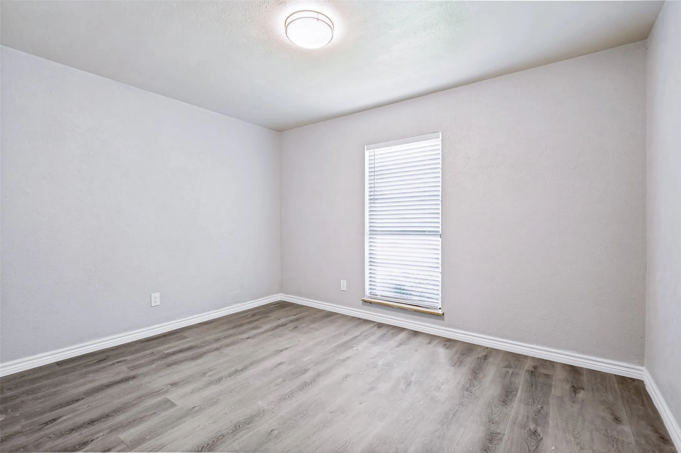 Located on the front wing of the home, this room is great for a bedroom, study or guest room. Closet not showing in picture...but it is there.