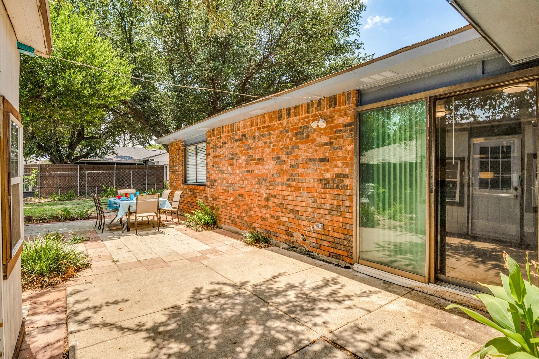 Access to the backyard and out building is provided by the kitchen doors.