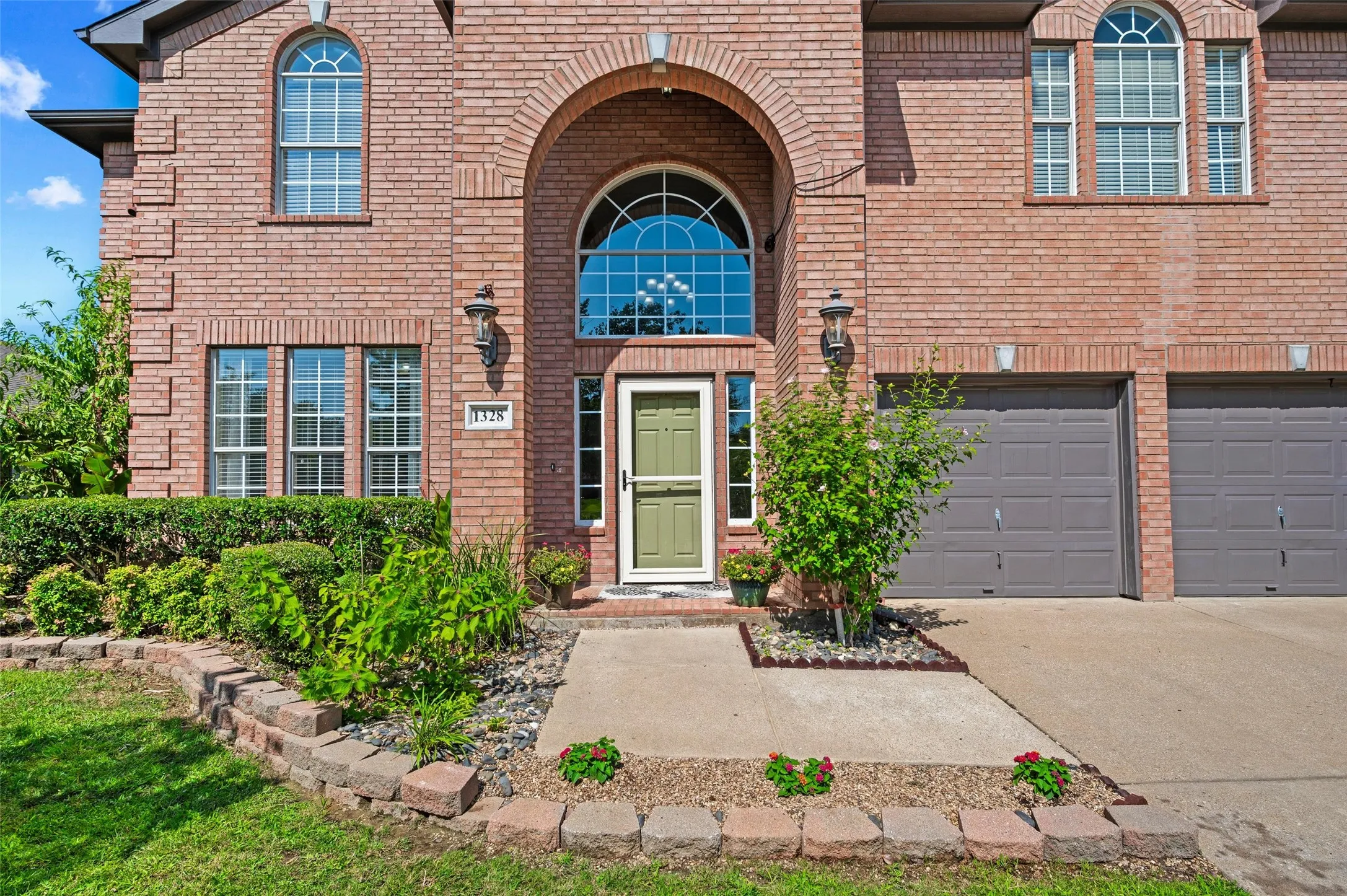 Front of home with a two car garage