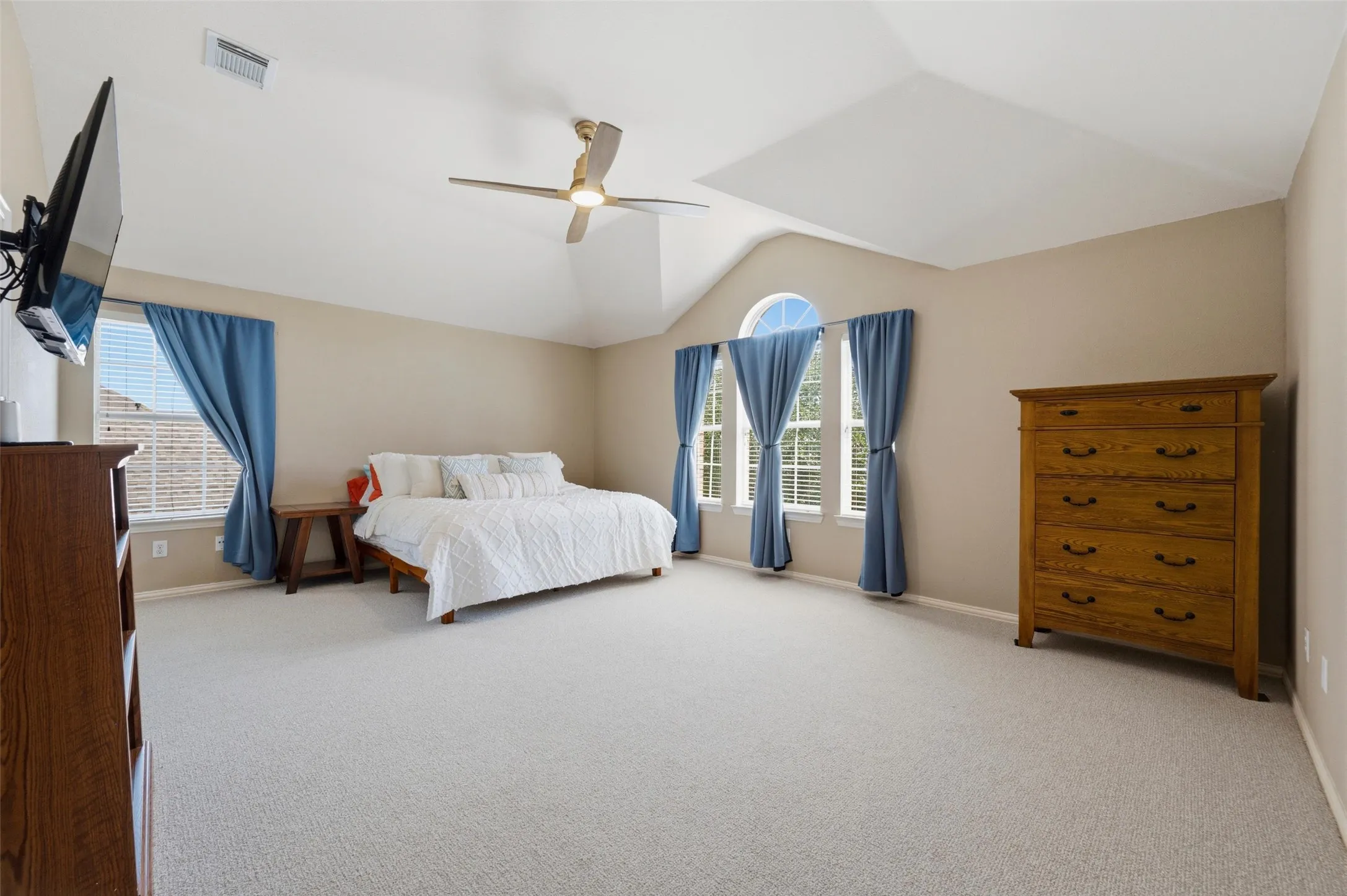 Light-toned wall paint and vaulted ceilings