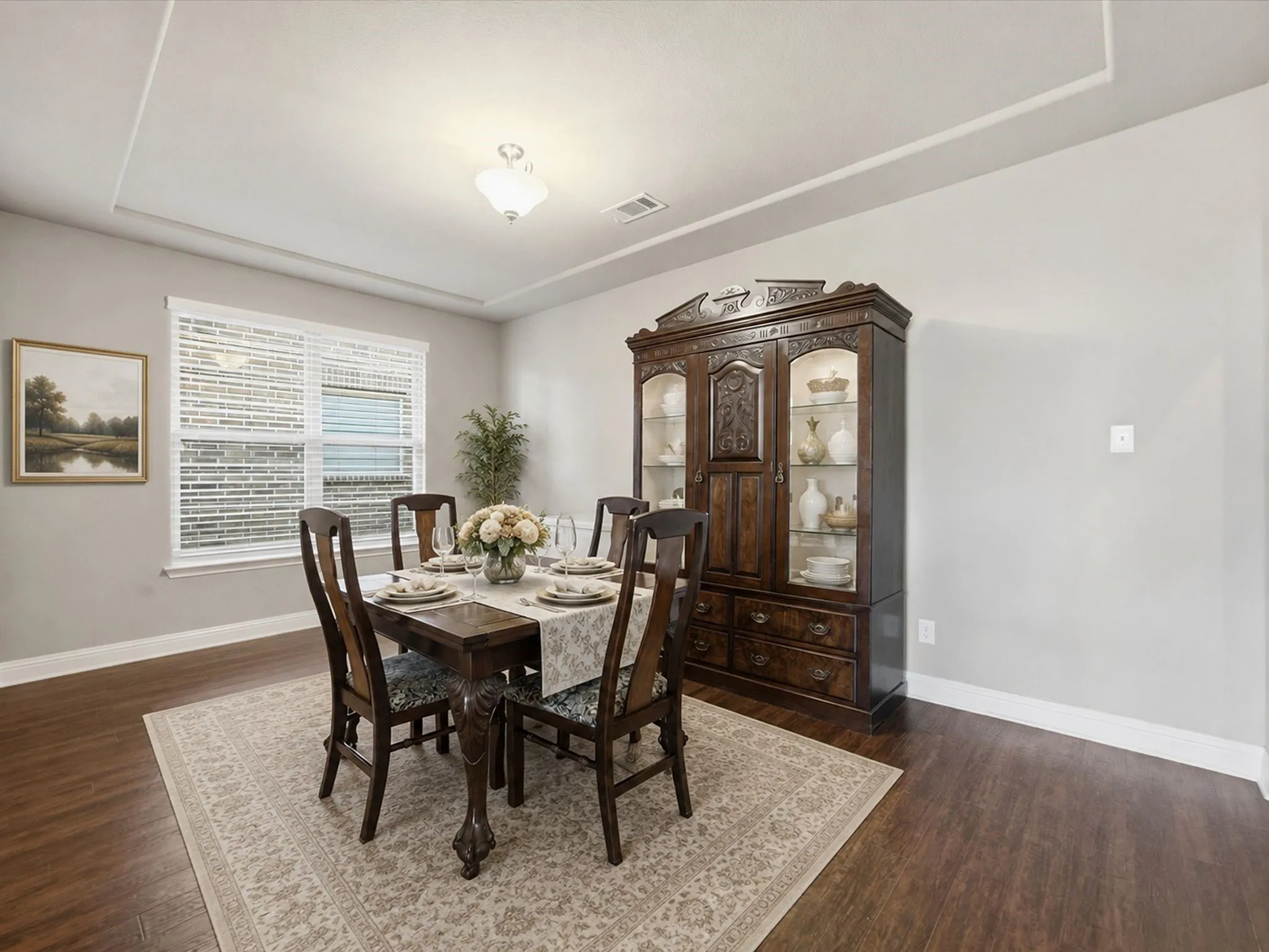 Recessed ceiling detail and wood-finish flooring