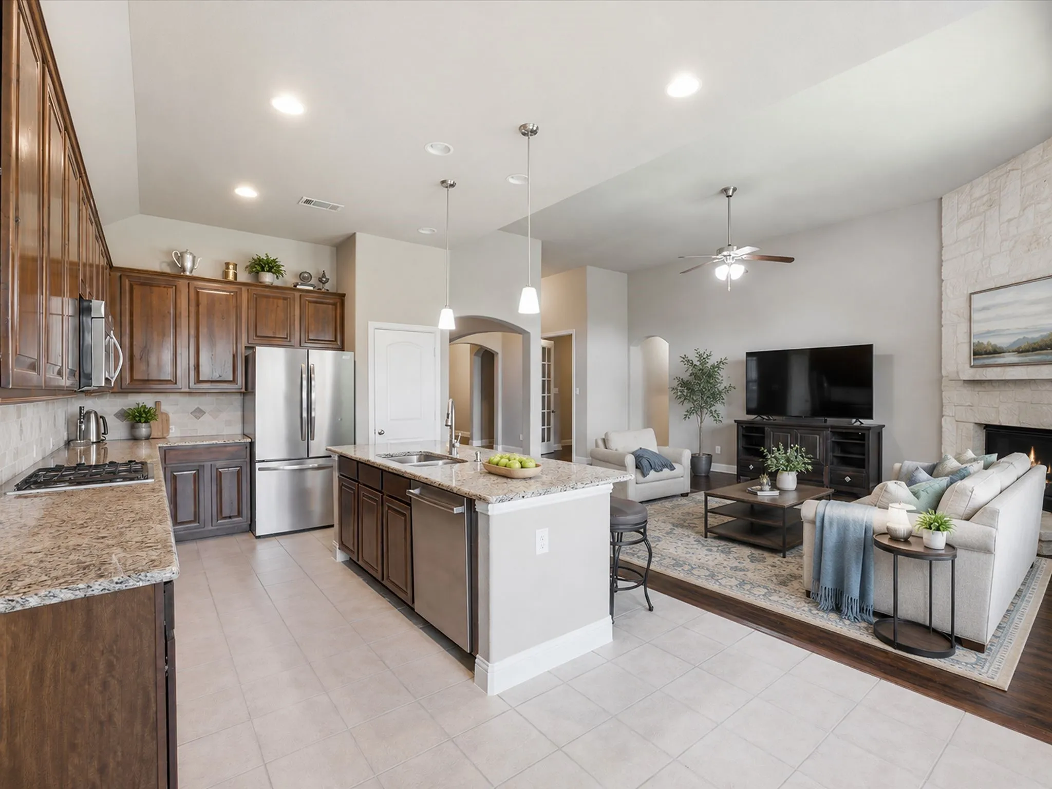 Gourmet kitchen with granite countertops, stainless steel appliances, and a central island