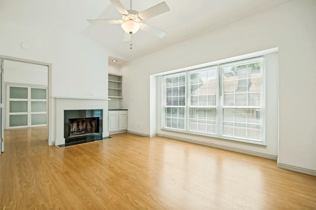 Woods floors and beautiful 2nd floor windows.