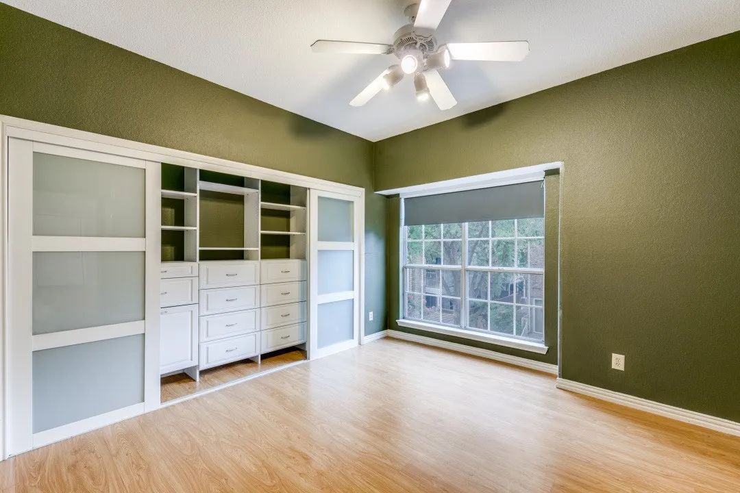Custom closet system in master bedroom. Currently w light colored walls.
