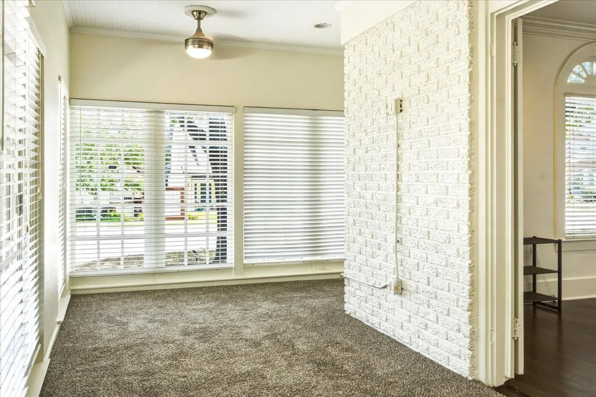 Sunroom, the only room with carpet in the whole house.  Remainder is original, refinished hardwoods.