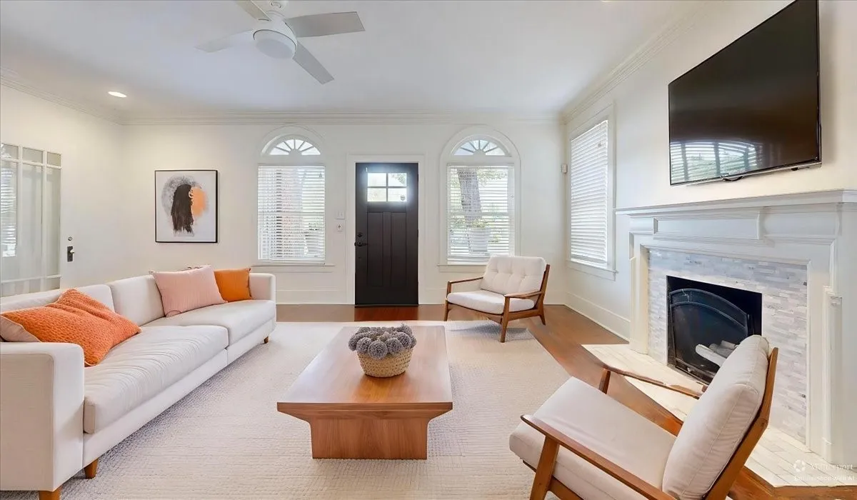 Entry living room with fireplace.  VIRTUALLY STAGED