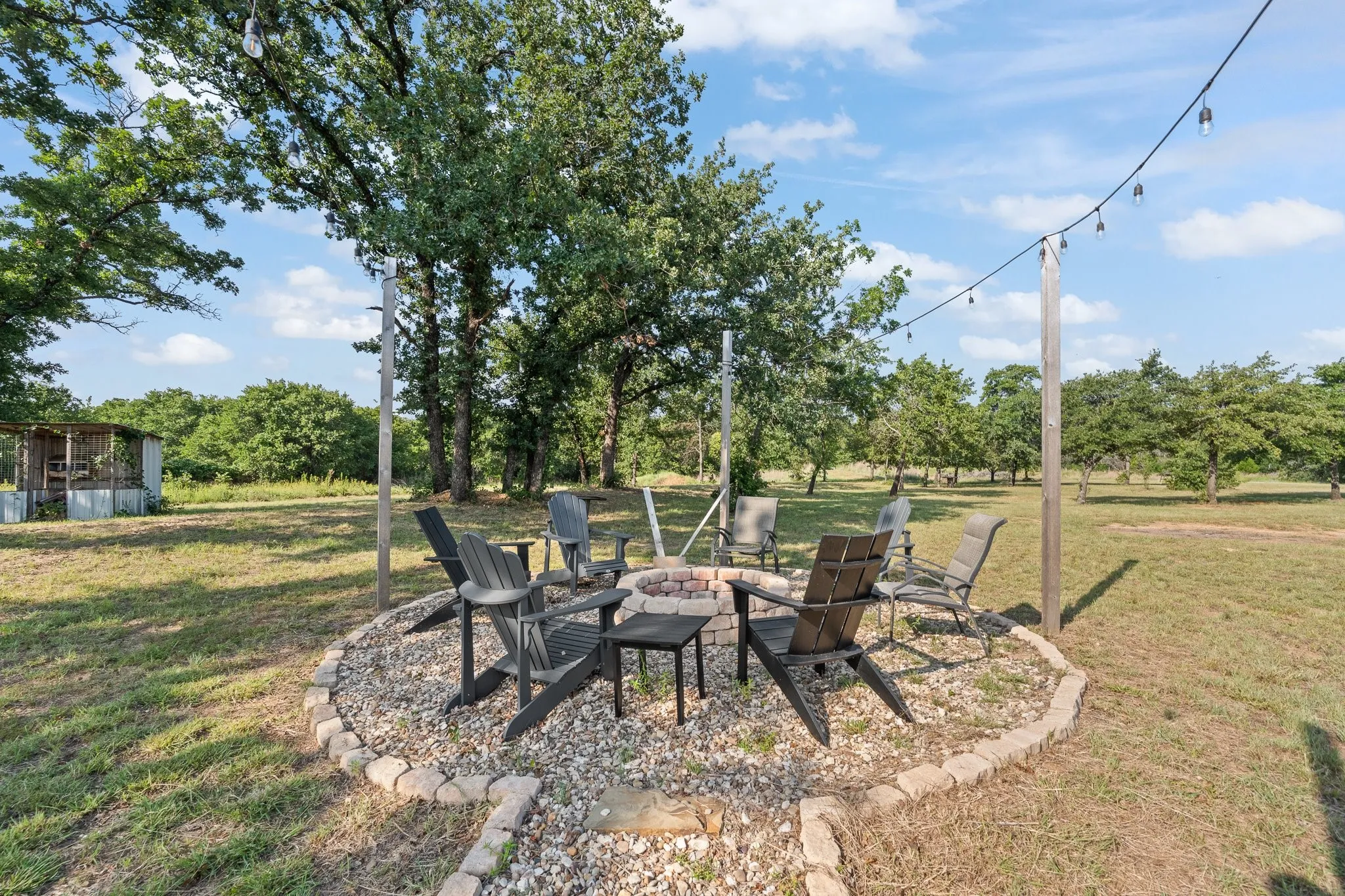Fire pit area with string lights