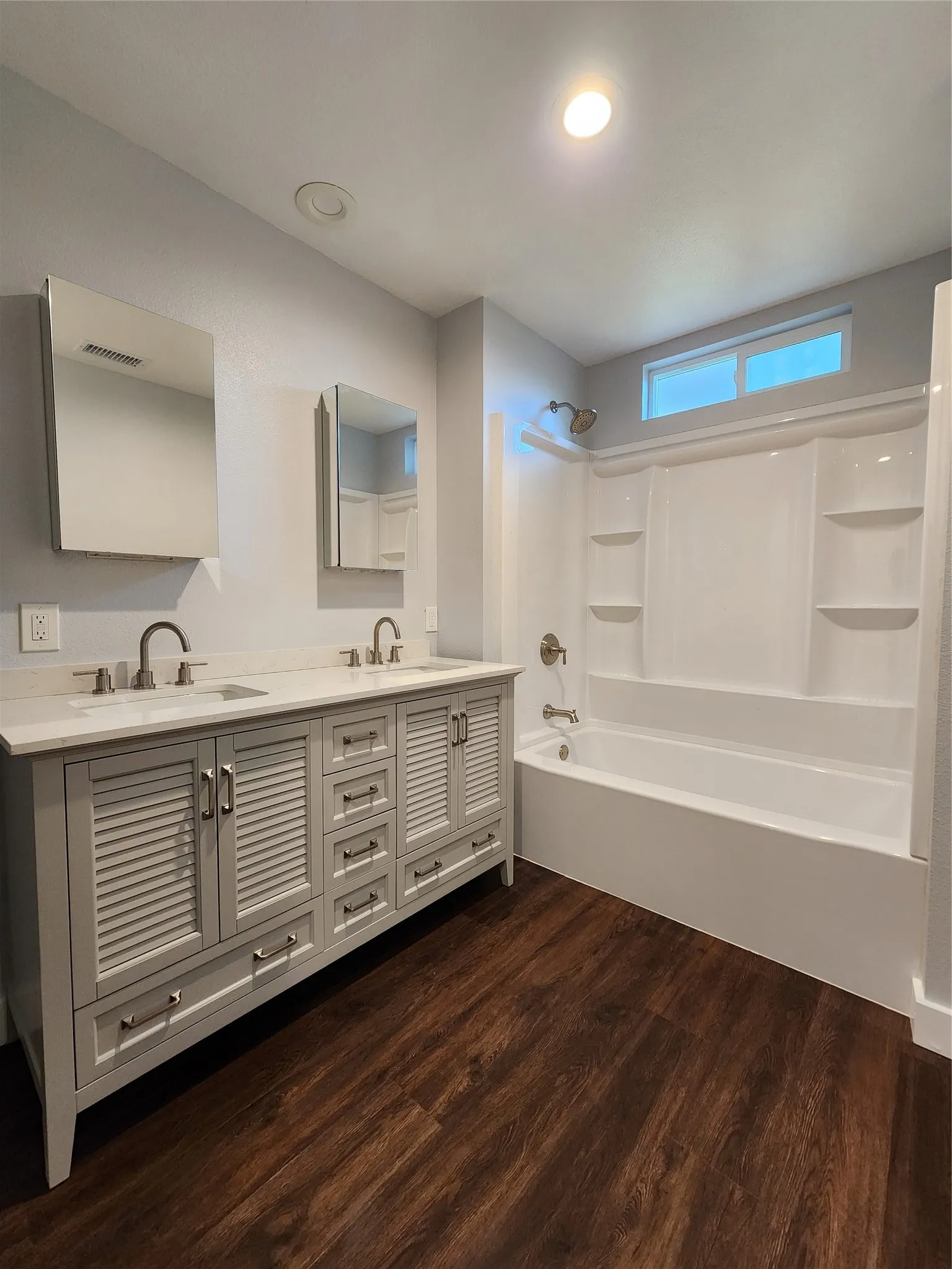Dual vanity with louvered cabinetry and undermount sinks