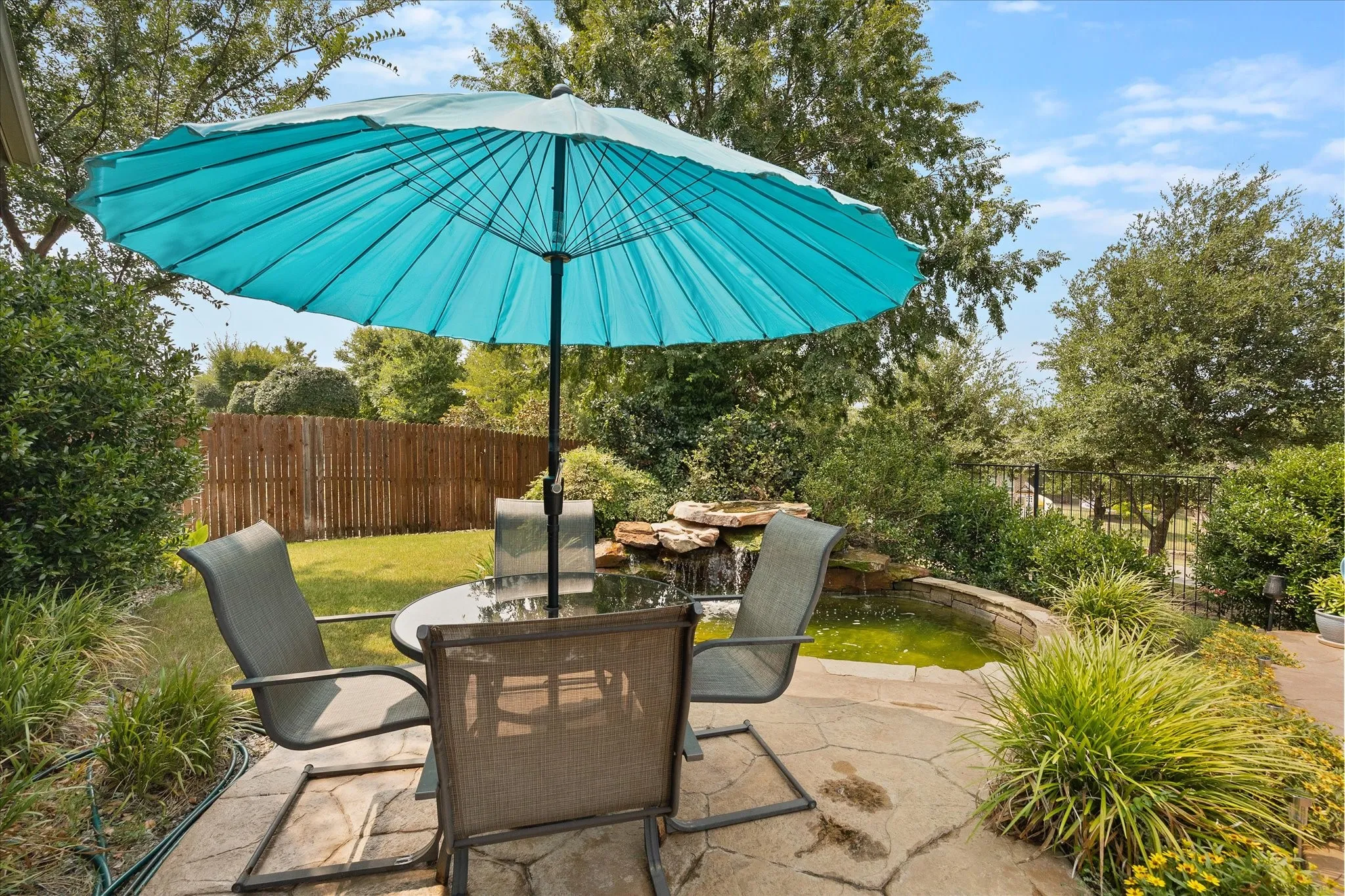 Lushly landscaped lawn is only one of this homes many amenities!
