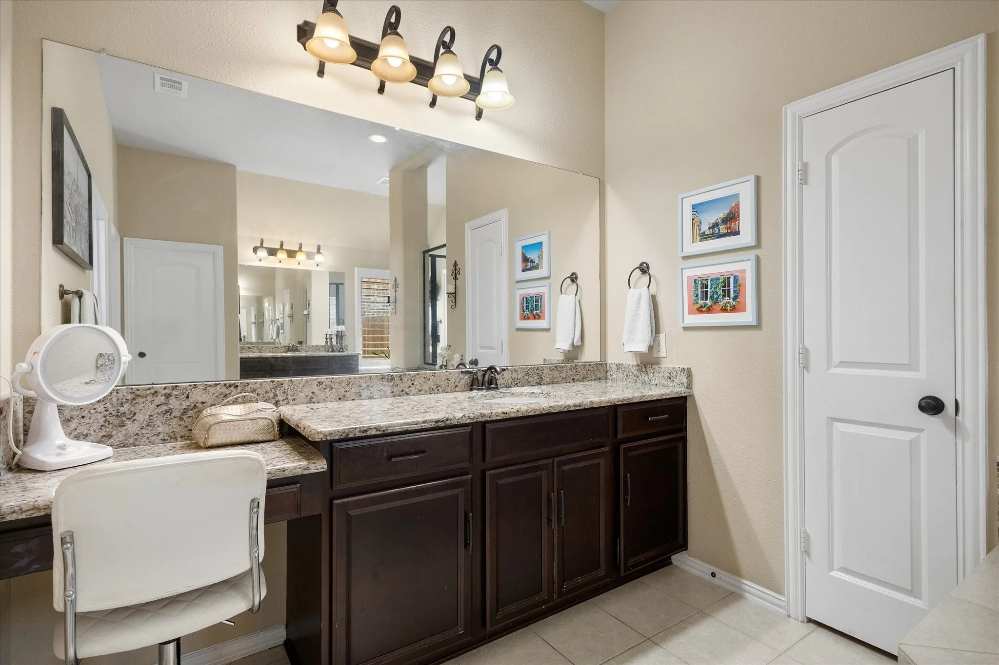 His and her vanities includes make up area.