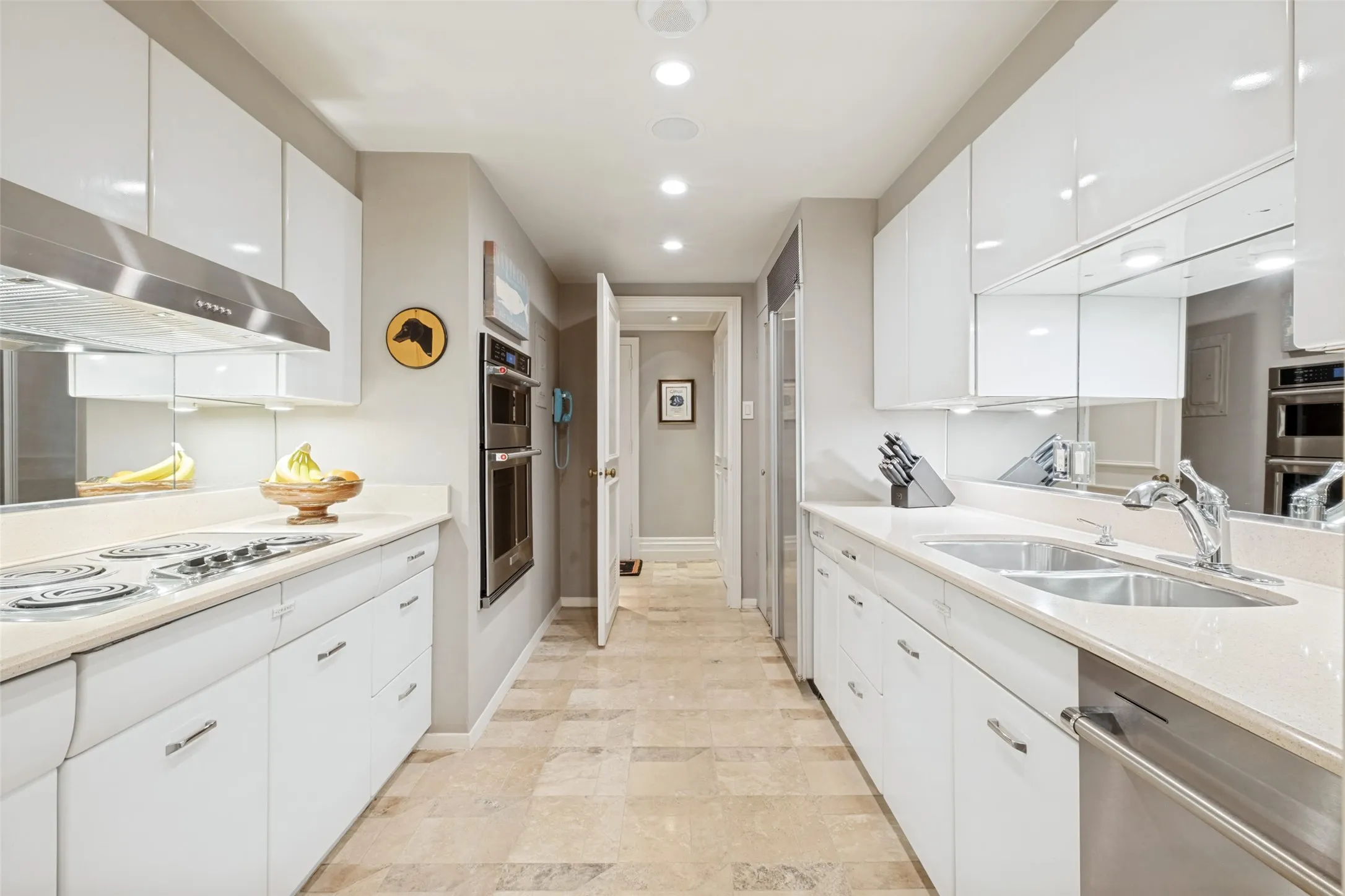 The galley kitchen is light, bright, and very functional.