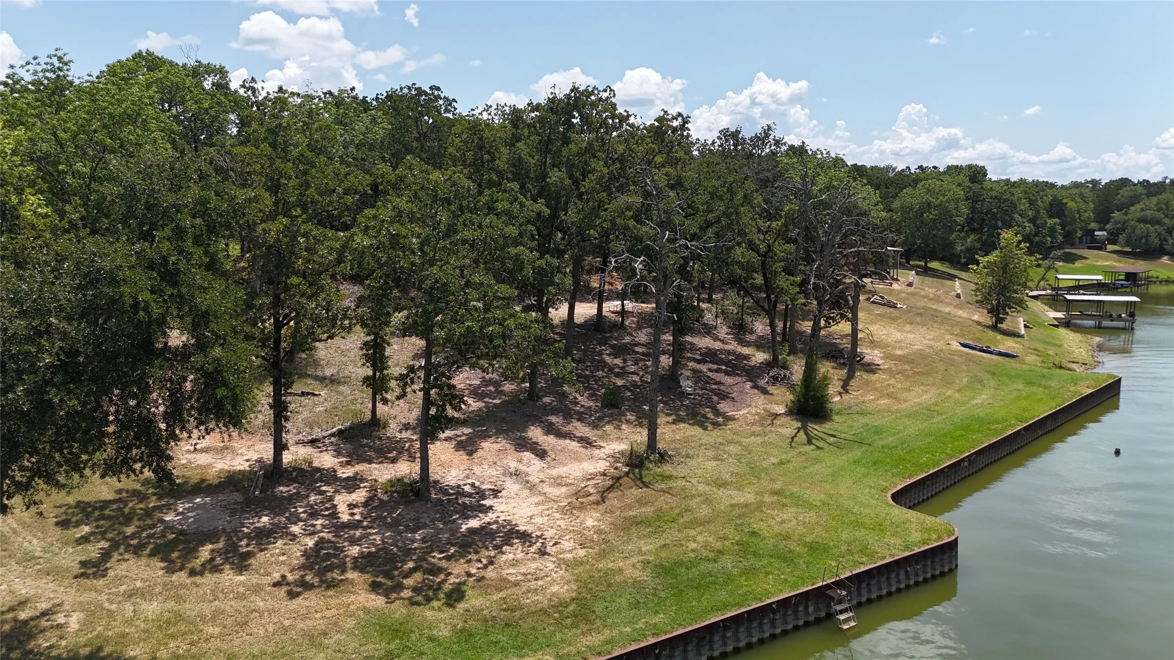 Mature trees provide character and shade across this waterfront property with direct access to Richland Chambers Lake.