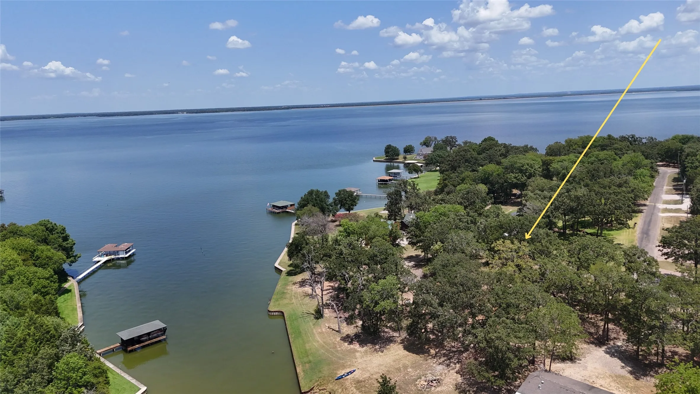 Elevated property perspective showcases the shoreline, surrounding lake and waterfront setting of Lots 8 and 13.