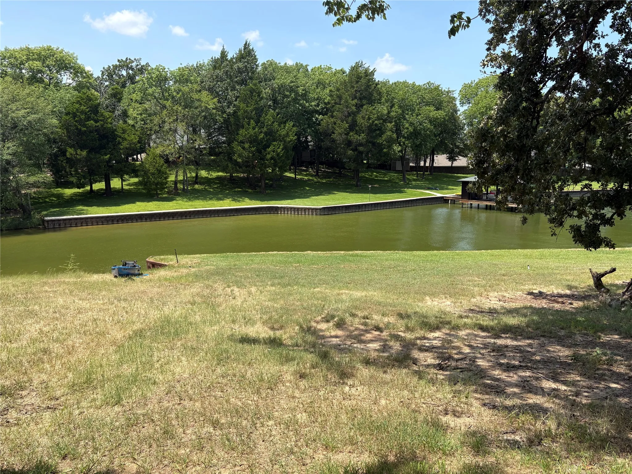 Protected water frontage creates a peaceful setting with convenient access to the larger waters of Richland Chambers Lake.