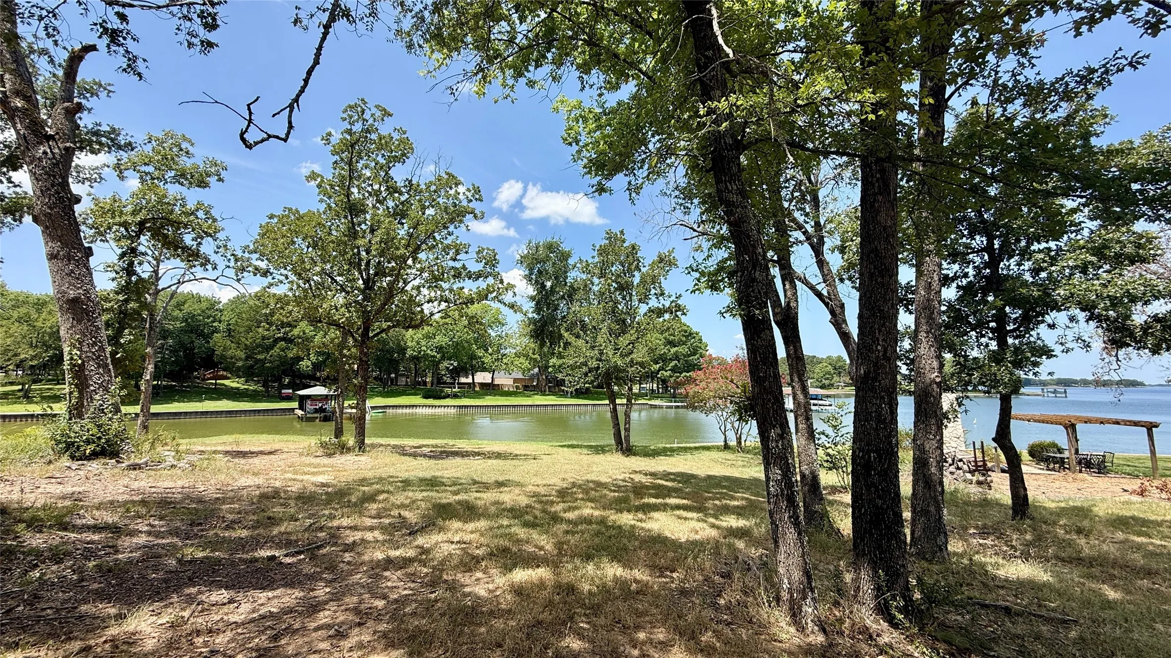 Mature trees frame a potential building area with water views on this nearly one-acre Richland Chambers Lake property.
