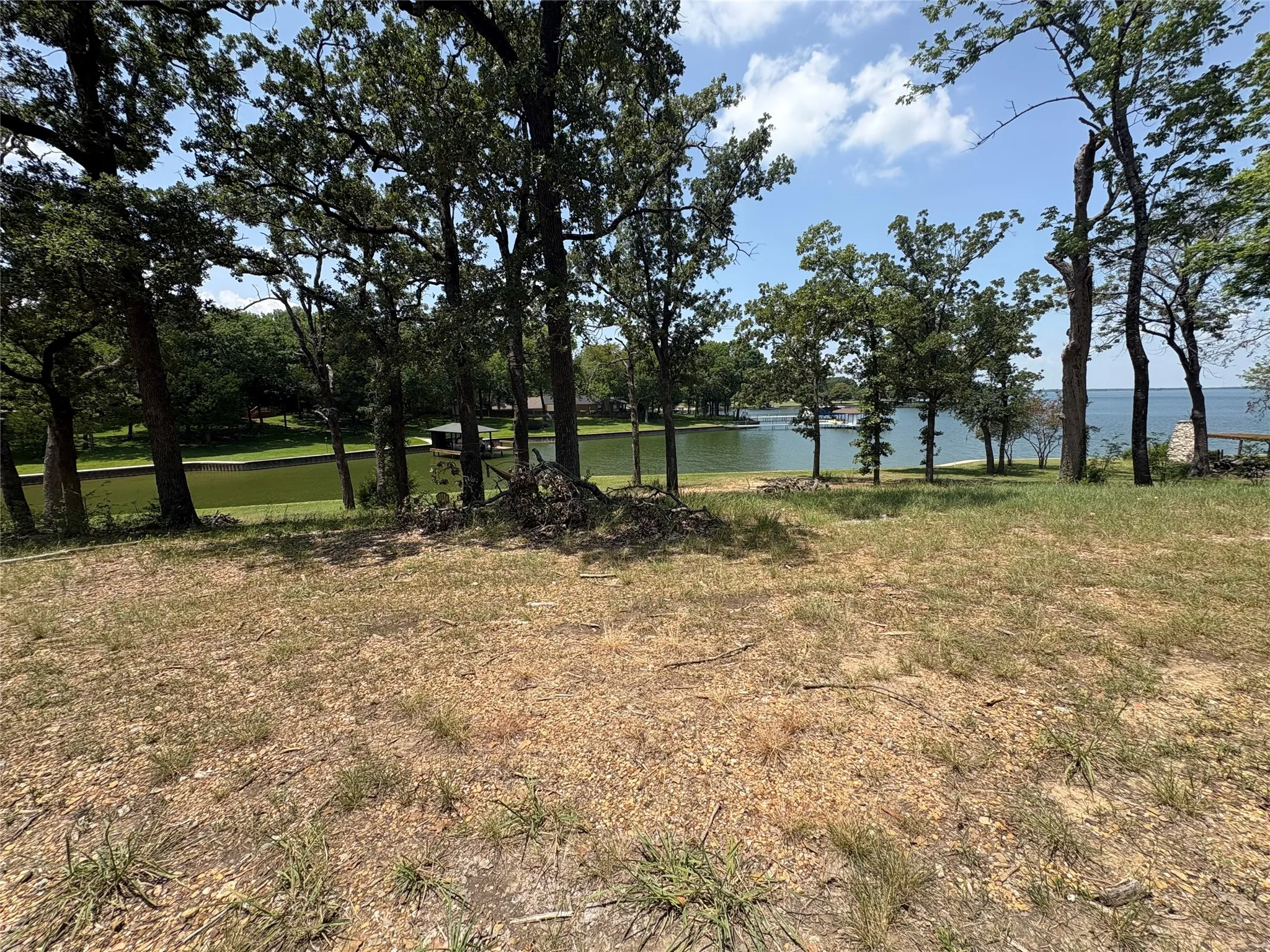 Spacious wooded building area offers mature trees, natural shade and glimpses of Richland Chambers Lake.