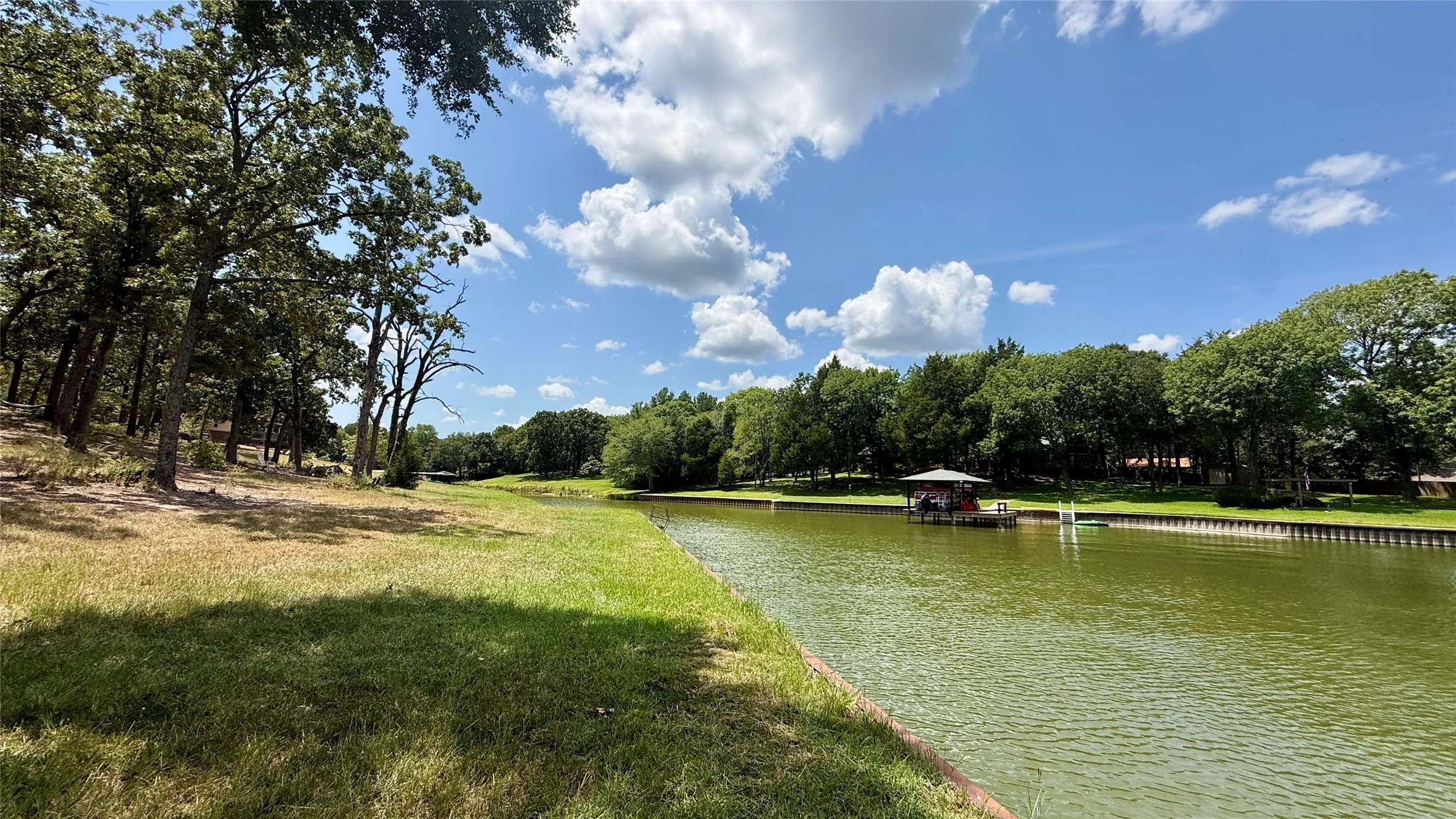 Expansive grassy shoreline provides room to enjoy the water while taking in the natural beauty of Richland Chambers Lake.