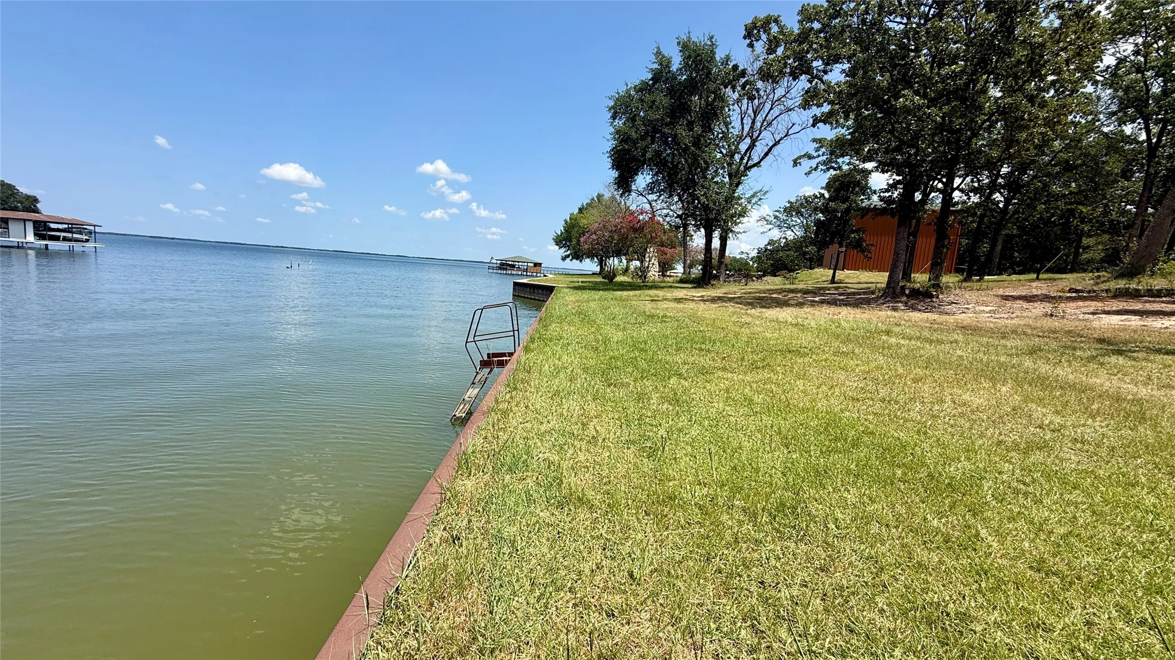 Grassy waterfront shoreline along Lots 8 and 13 on Cambridge Drive with direct access to Richland Chambers Lake.