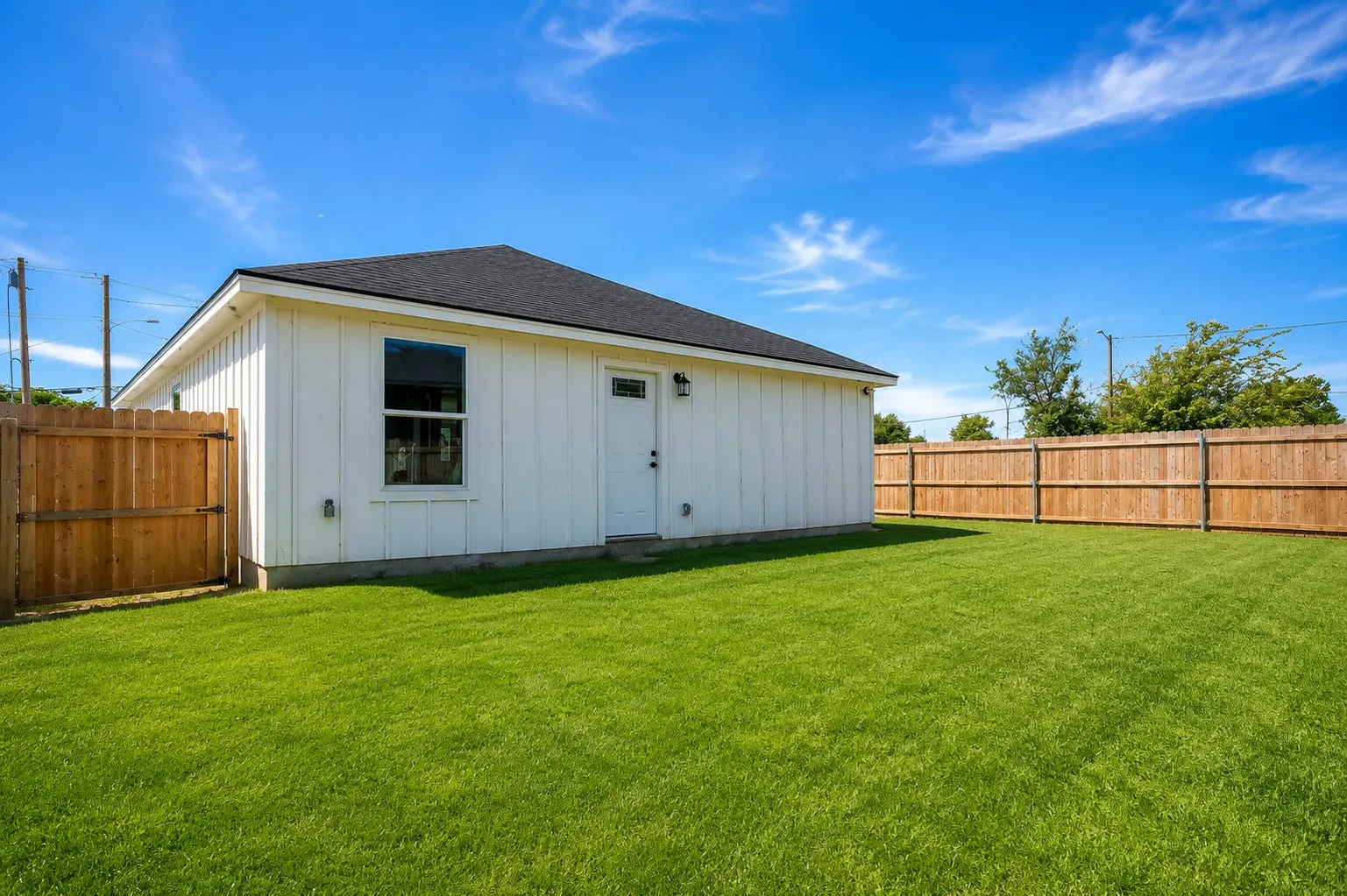 Fenced Backyard-AI enhanced with green grass to show potential