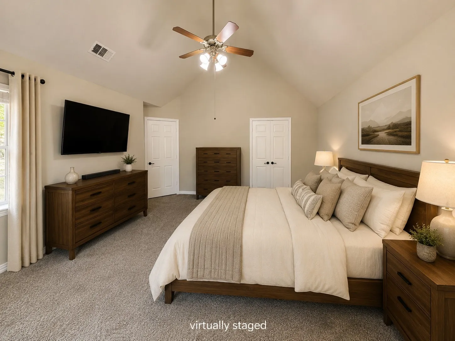 Master bedroom. Vaulted ceiling, ceiling fan with integrated lighting, neutral-toned walls, and soft carpet flooring