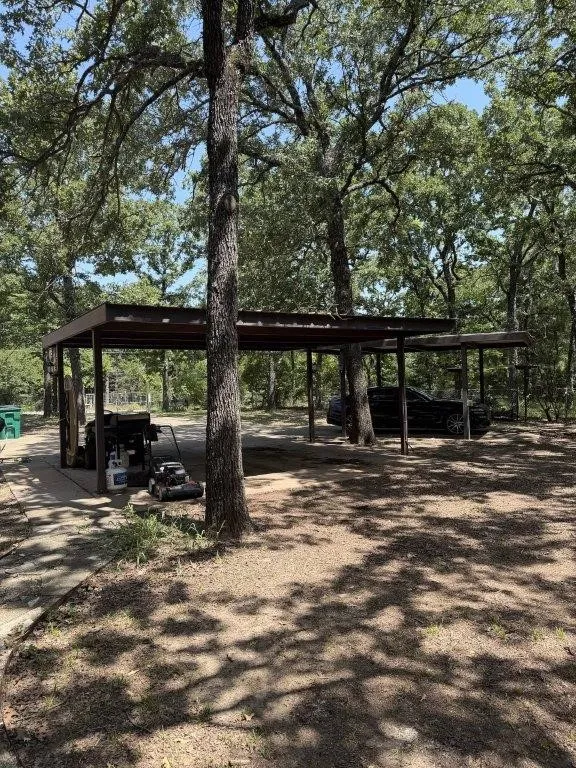 Three concrete carport spaces with cover