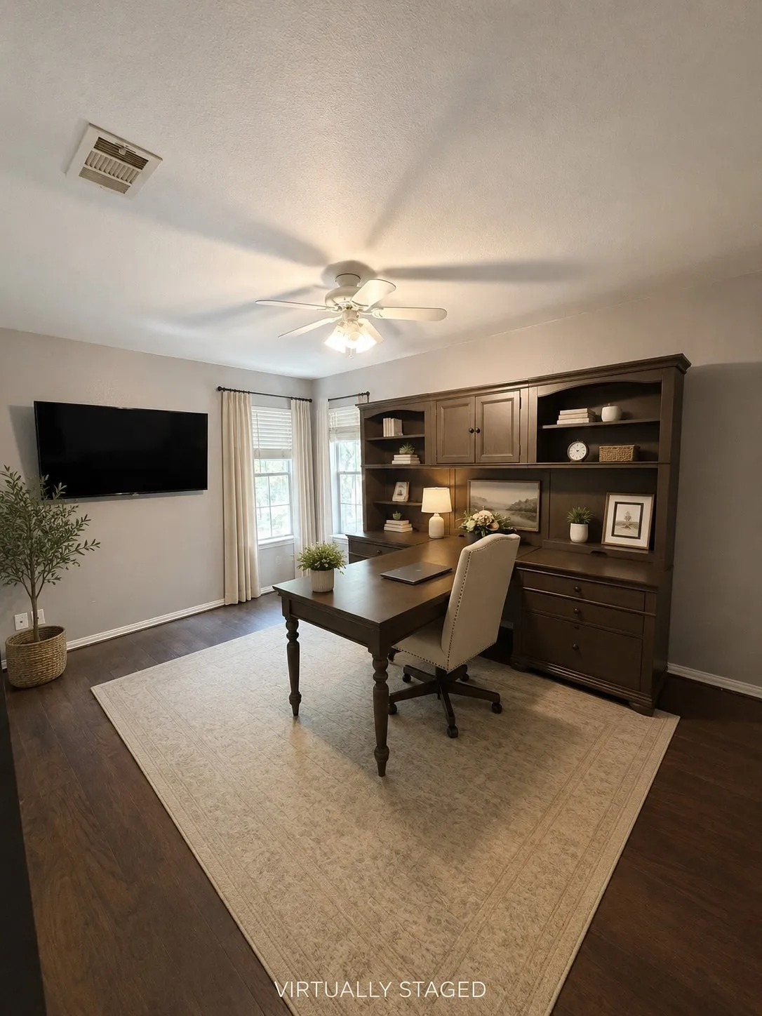 Upstairs bedroom 1, currently used as office. Wood-finish flooring throughout