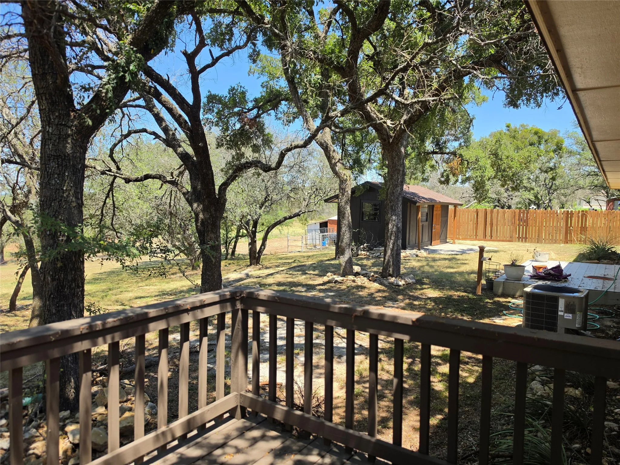 Wood-finish deck with baluster railing