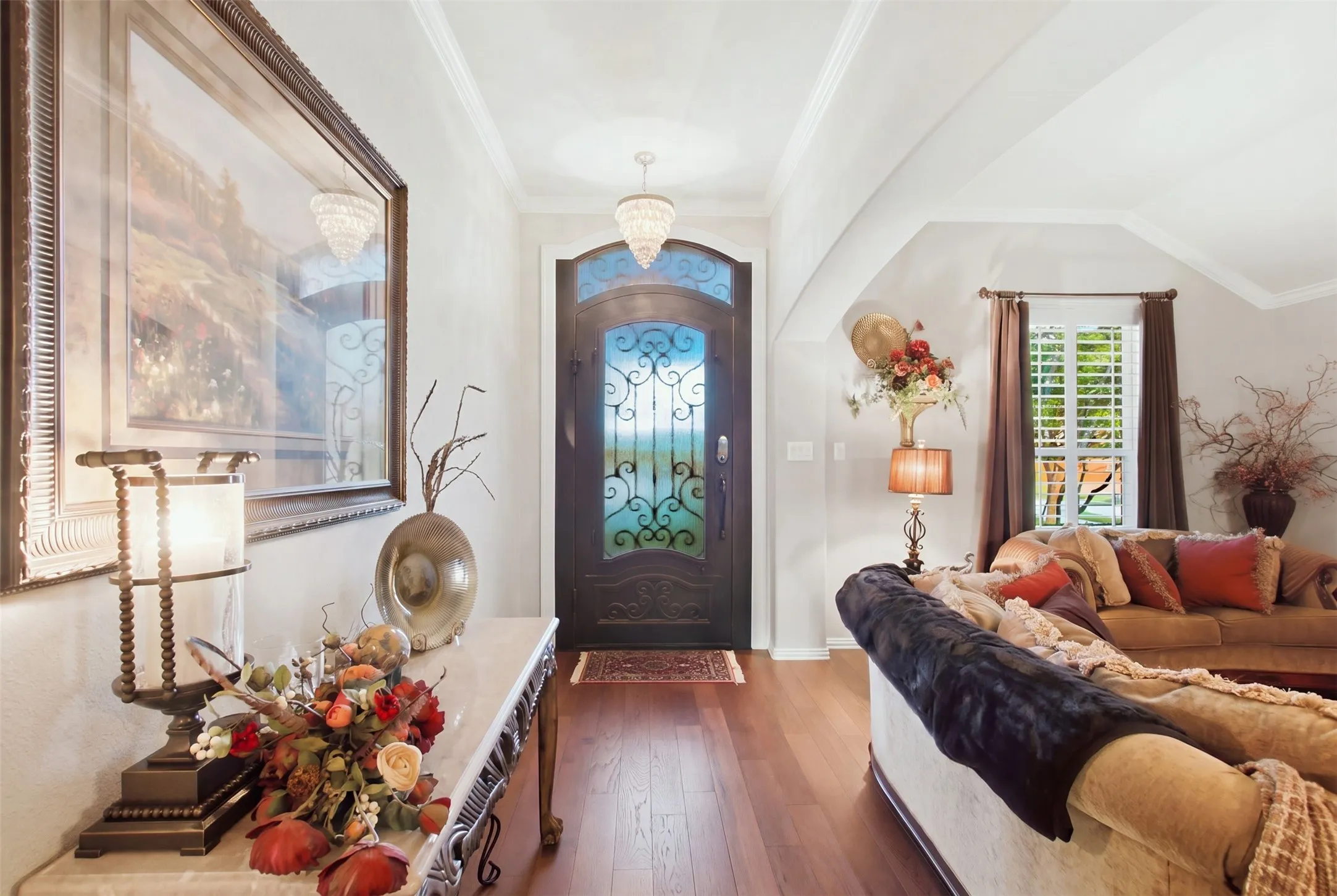 Rich wood-finish flooring throughout the entryway