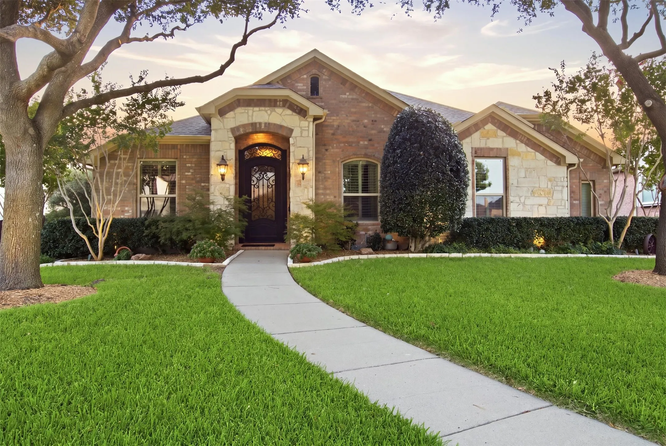 Brick and stone facade with an arched entry