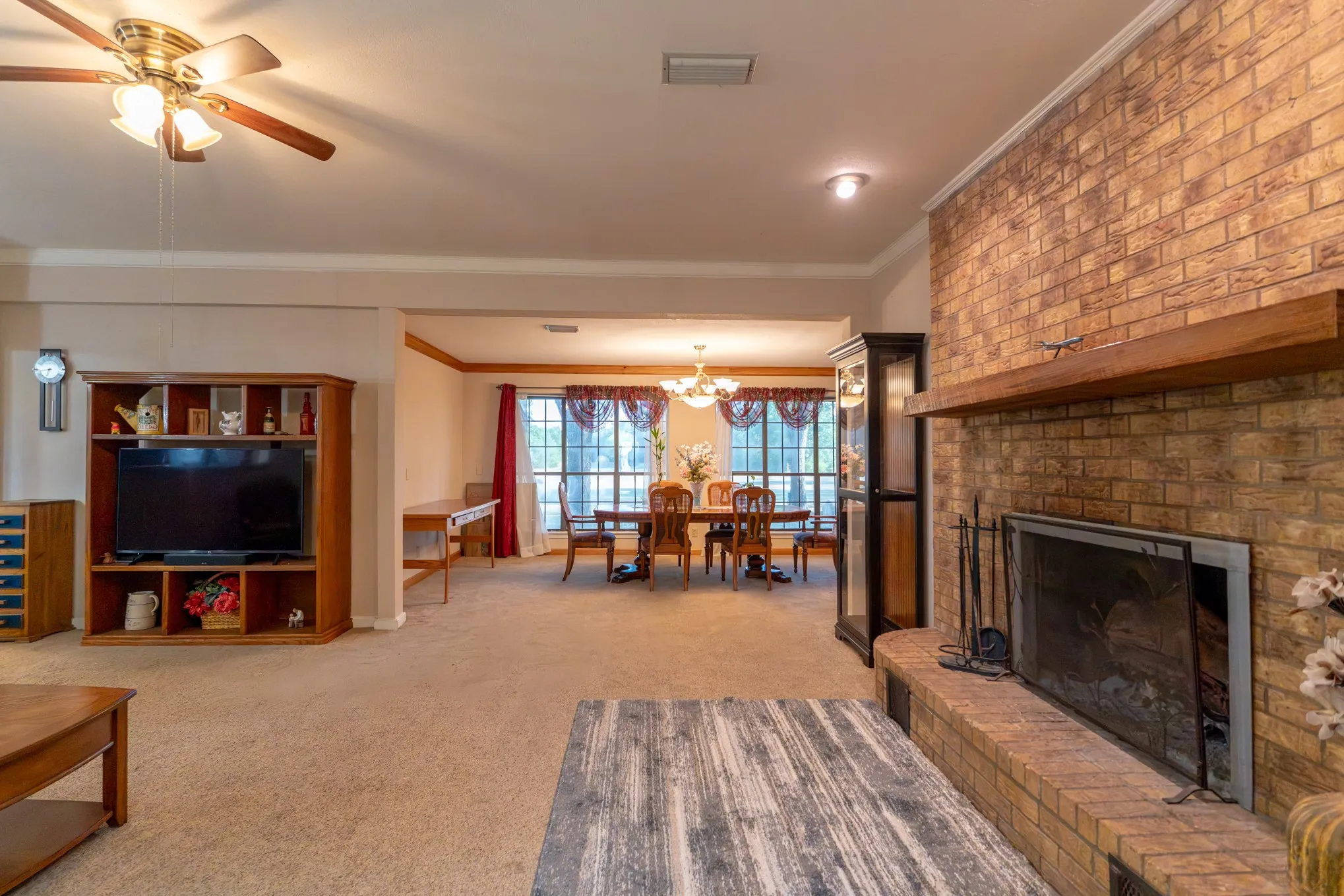 Brick fireplace with a wood mantle