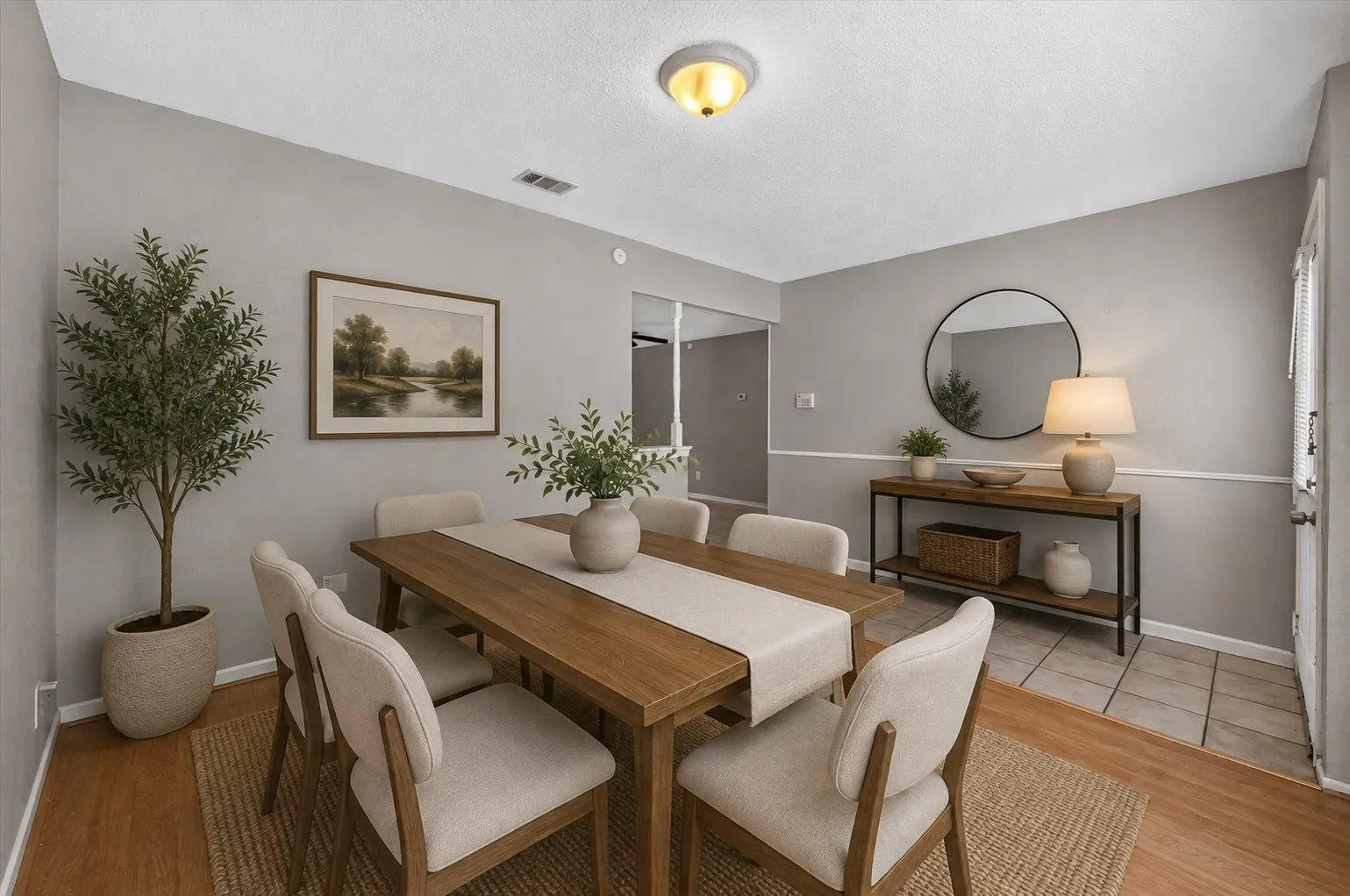 Virtually staged to showcase the potential of this versatile front room as a welcoming dining space.