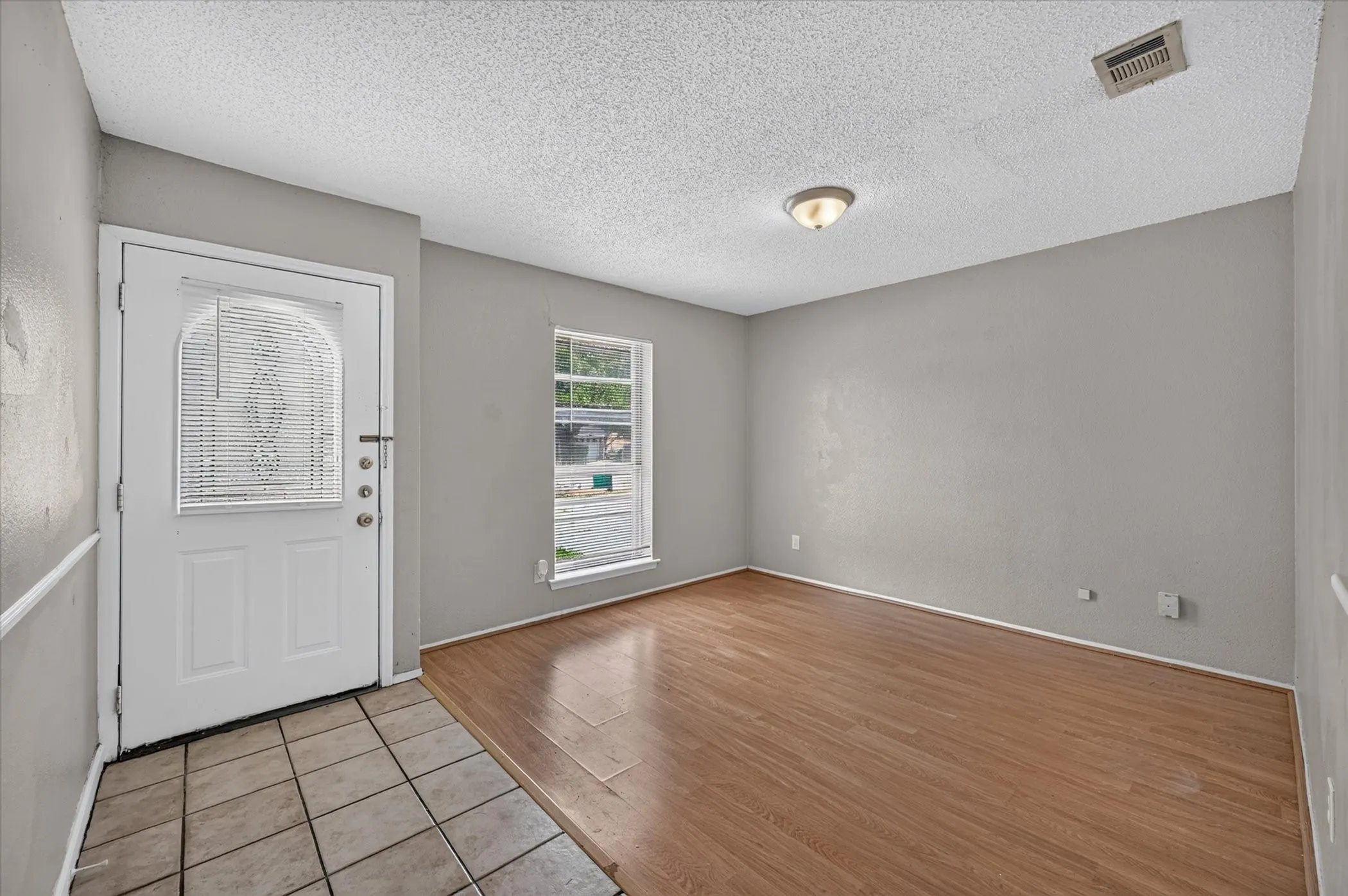 Front entry with neutral palette.