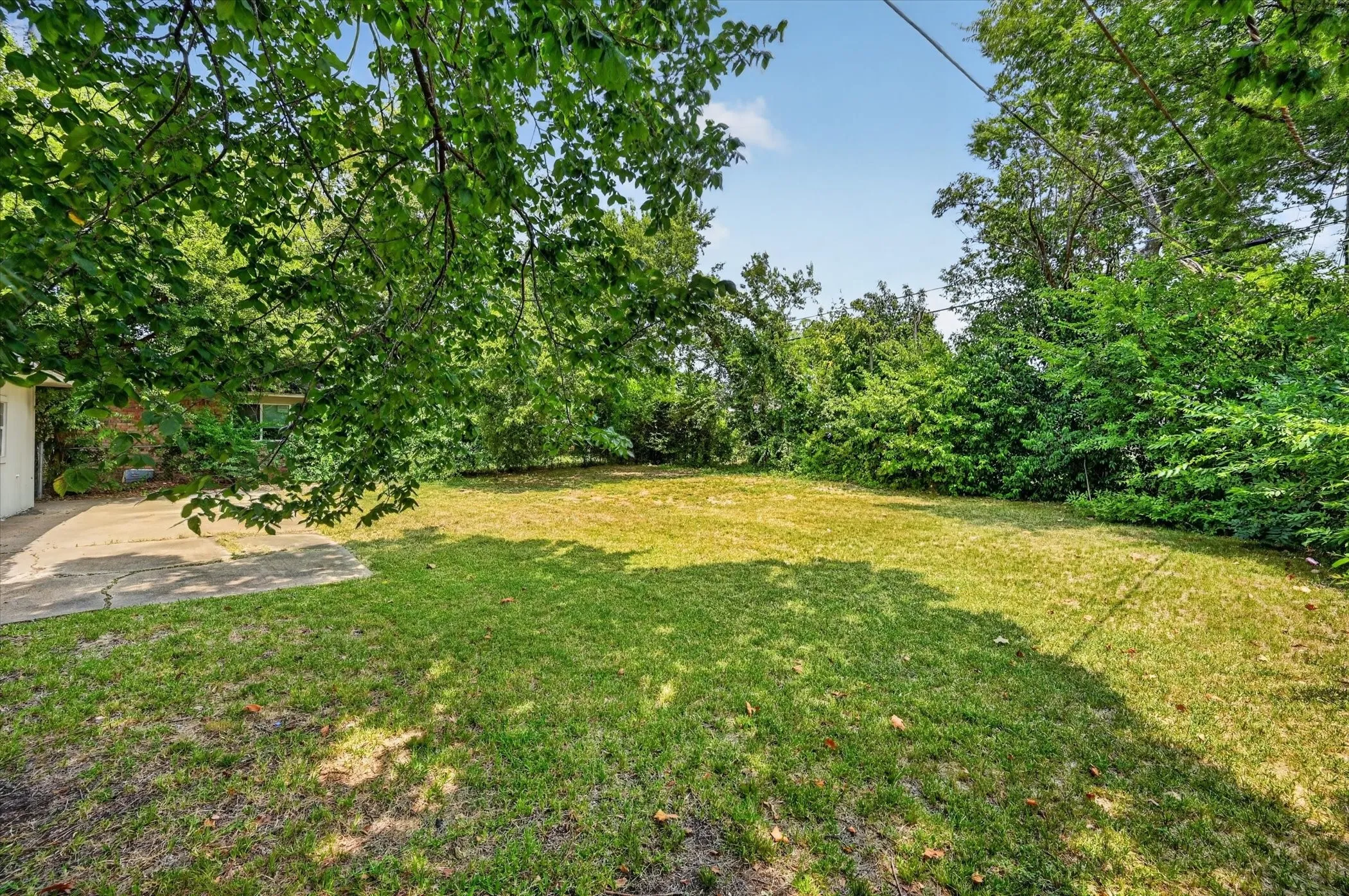 A HUGE backyard with enough room for a pool, or a storage shed, or playset, or all three!