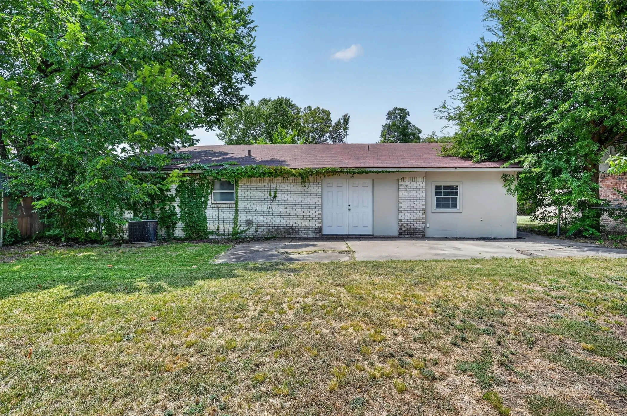 The backyard features an open patio and LOTS of possibilities!