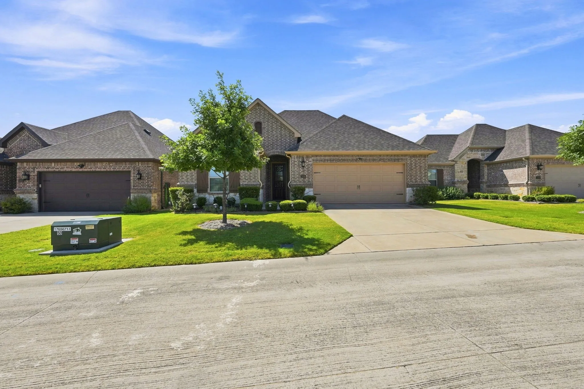 Brick exterior with stone accents and a gabled roofline