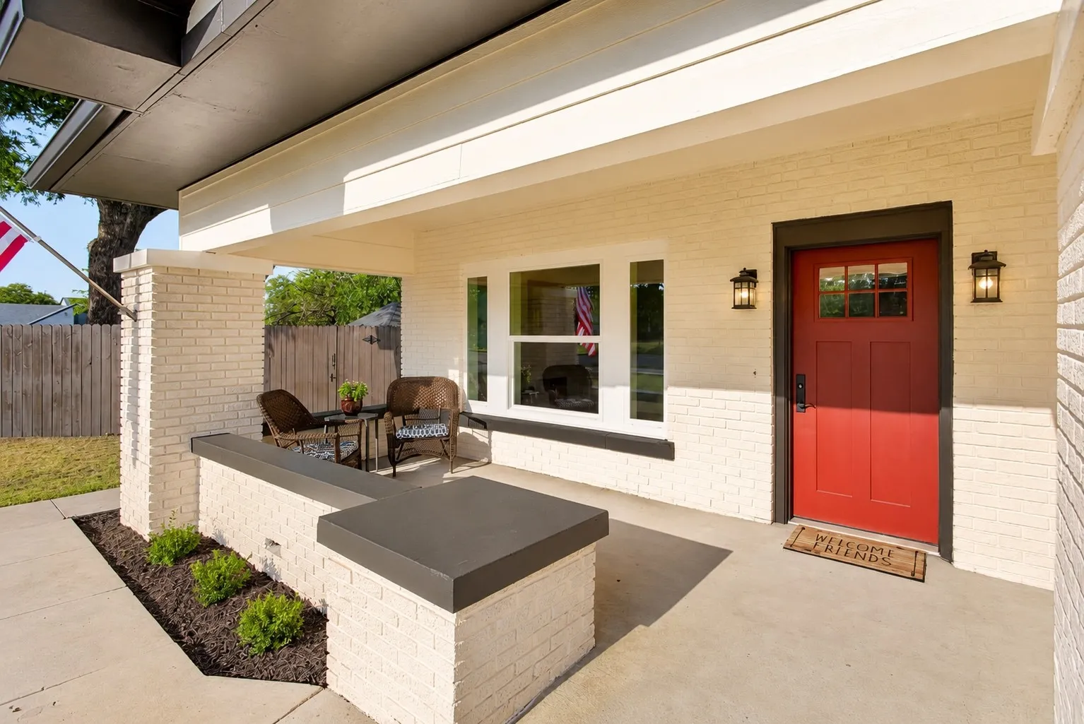 A generous front porch - just as you would expect from this style of home - a great place for coffee.