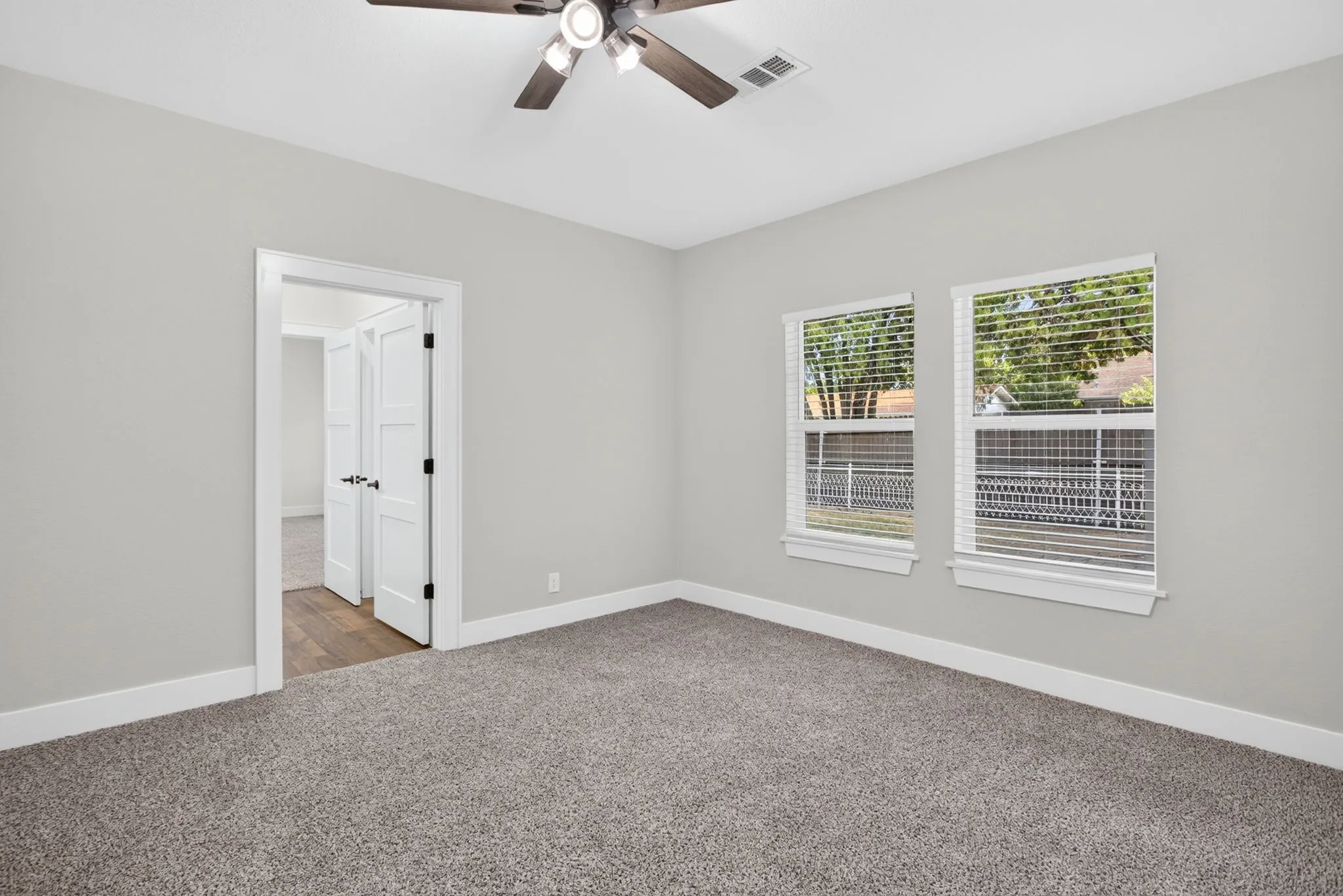In the opposite hallway are two secondary bedrooms connected by a Jack and Jill bathroom.
