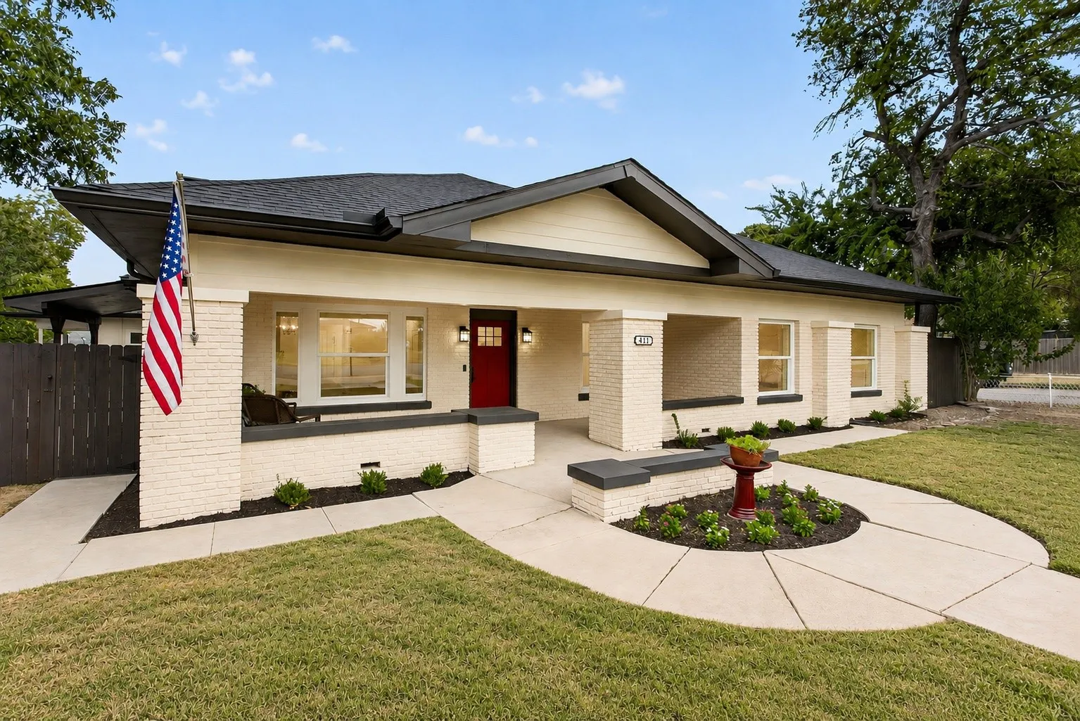 Circle drive, new sod, new fencing, lovely garden beds, fresh exterior paint, new lighting, new door, new windows.