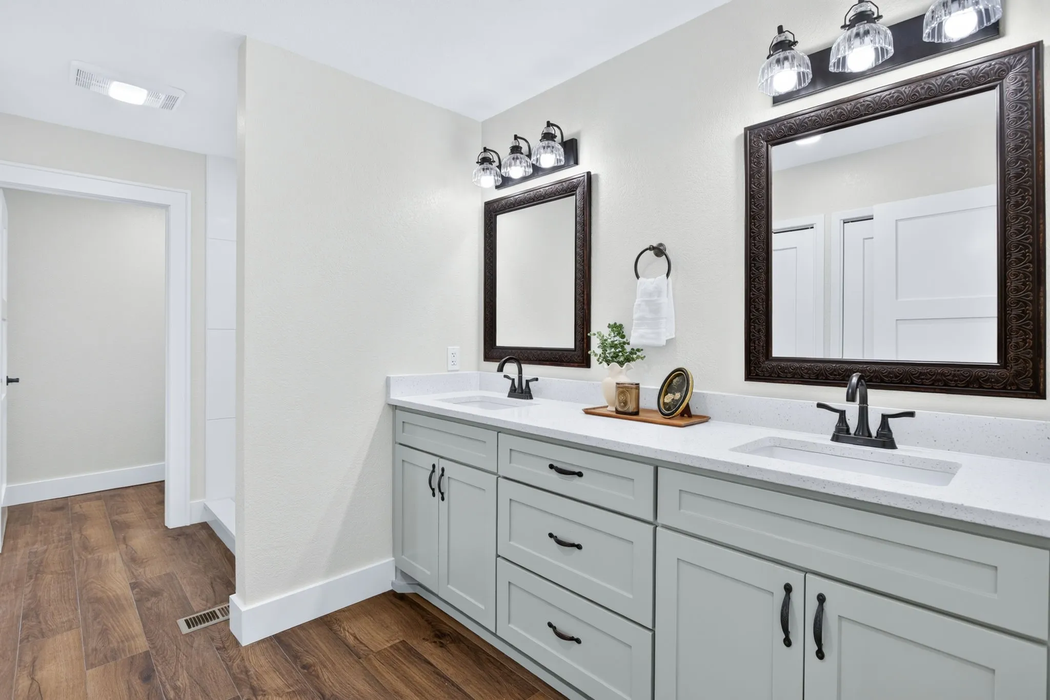 The ensuite bathroom enjoys tons of storage, dual sinks, a separate toilet area, a huge walk-in closet. And yes - everything is new.