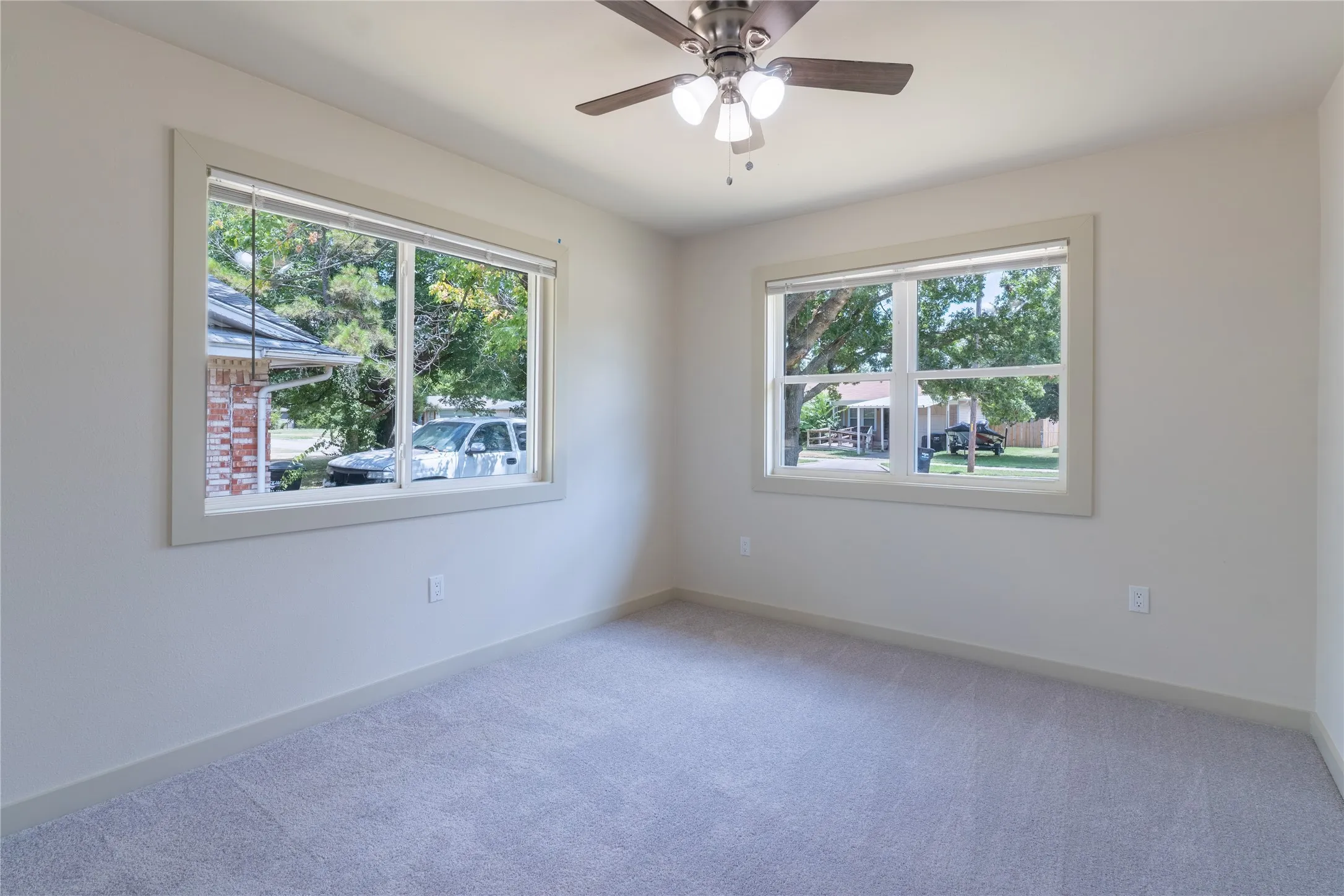 Neutral wall color with two large windows