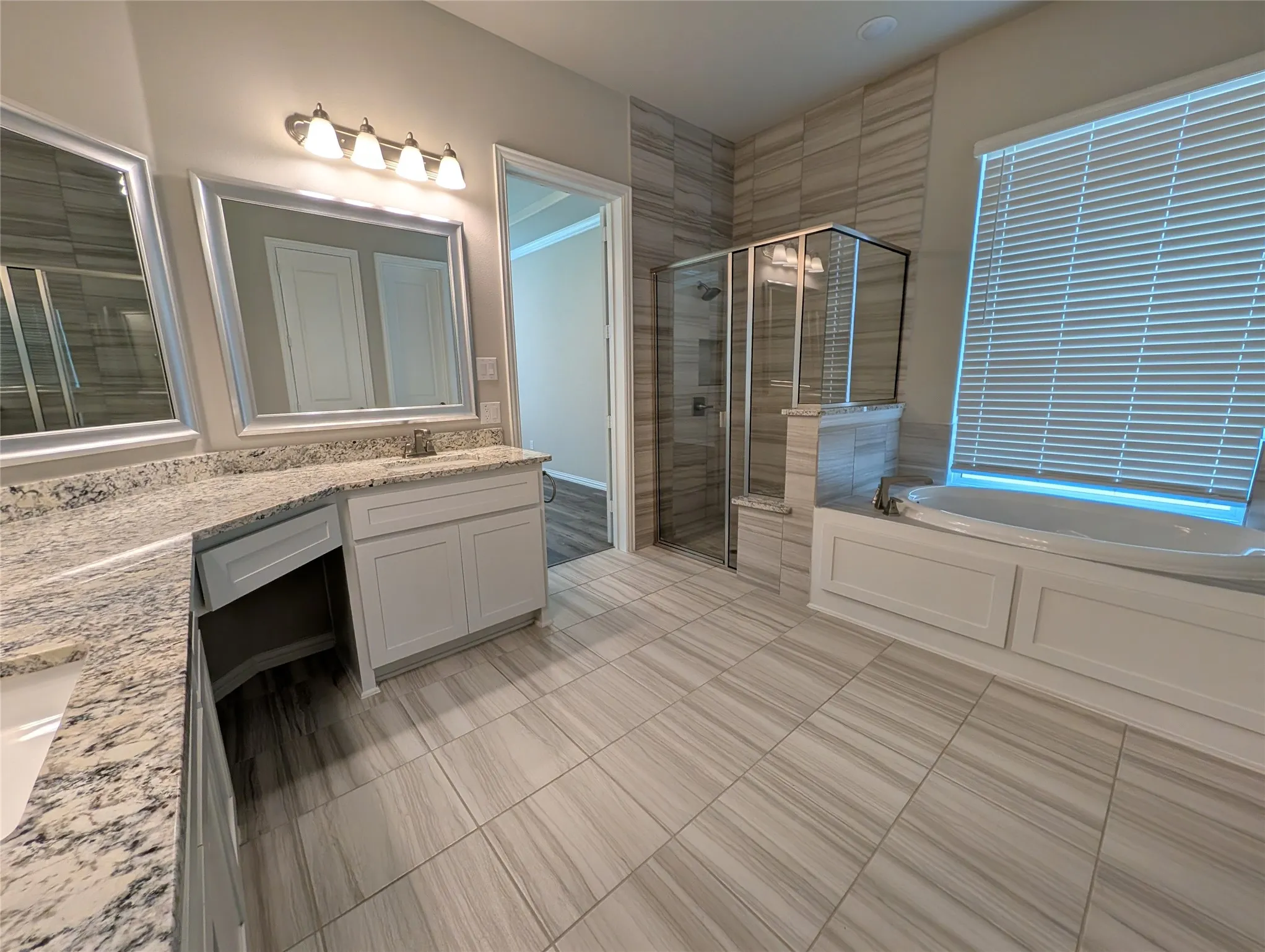Dual vanity with granite-style countertop and integrated sinks