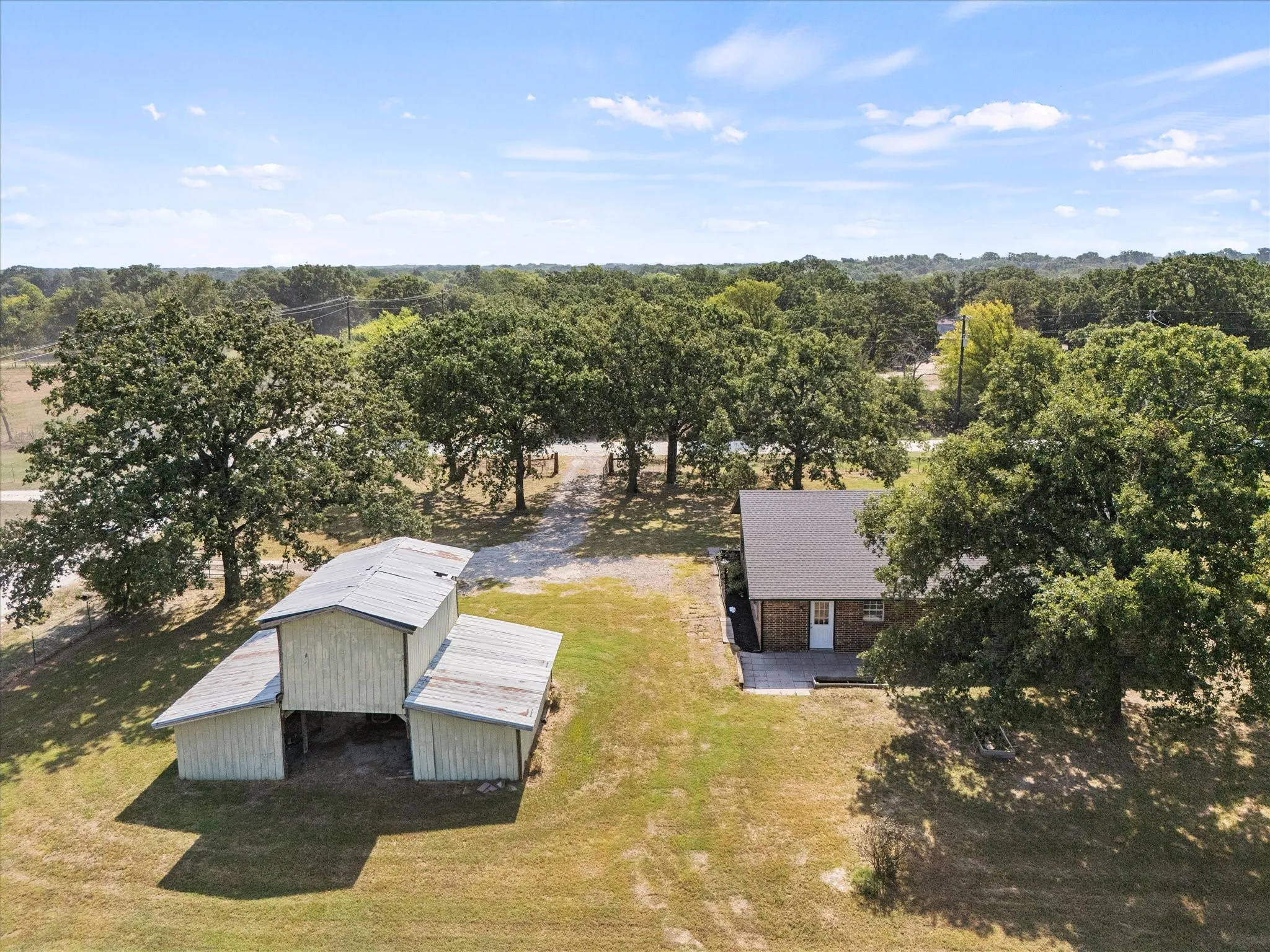 Expansive property with a single-story residence and a multi-level outbuilding