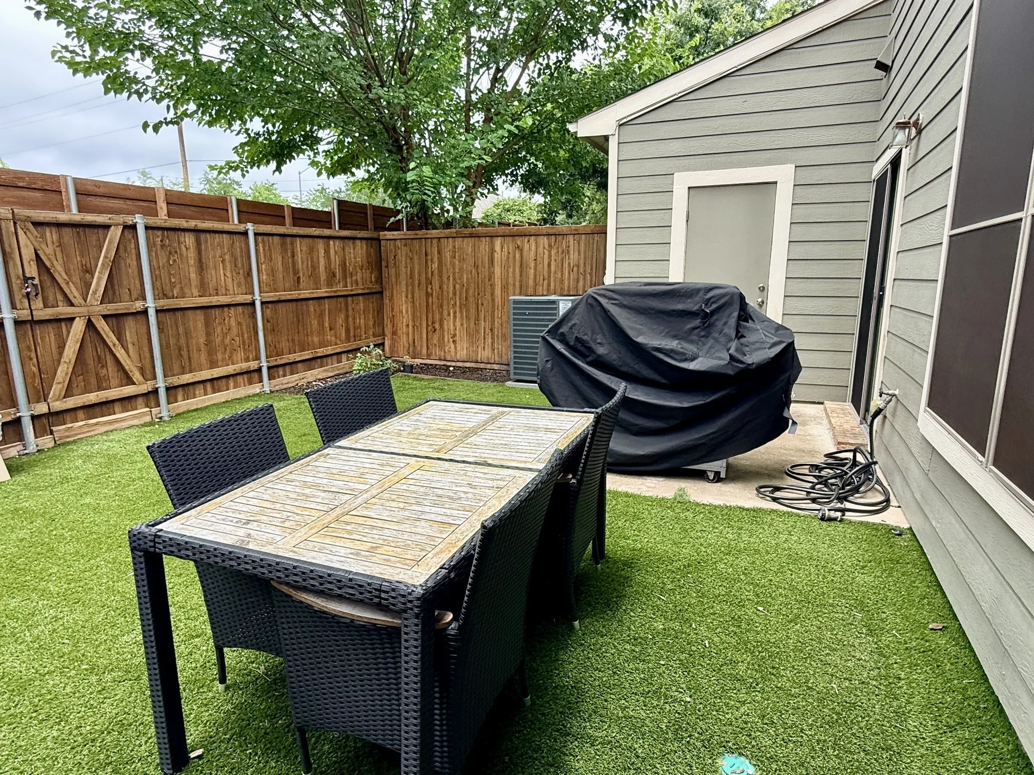 back yard has storage closet, privacy fence and turf...no mowing