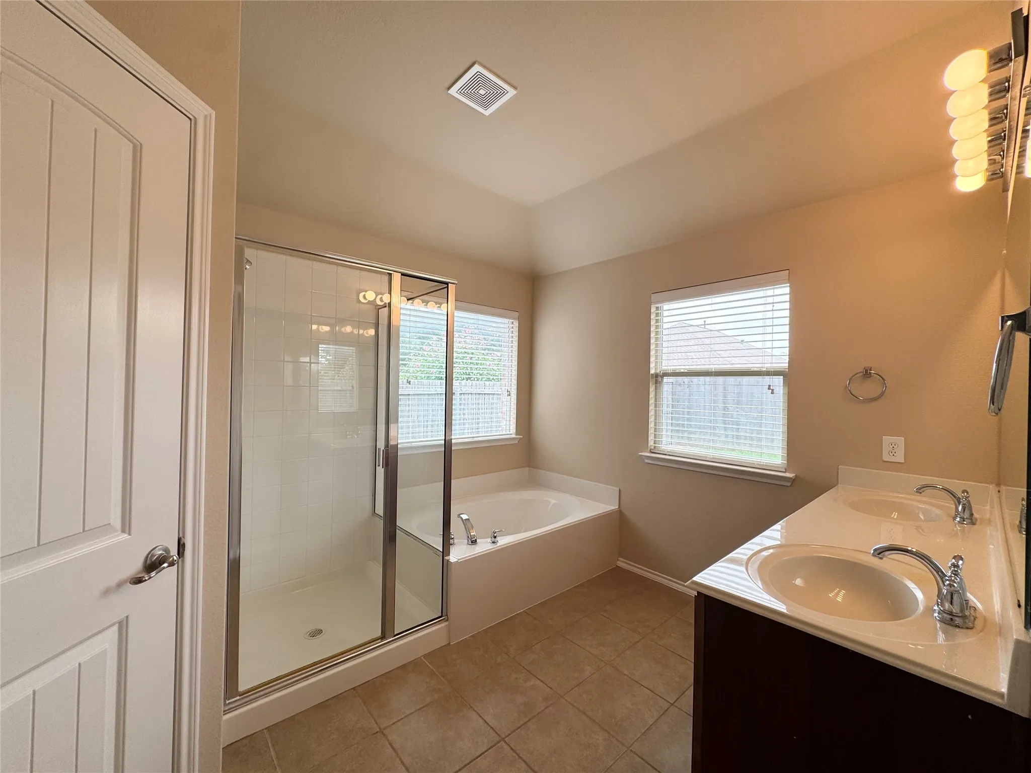 Master bath with dual sinks, garden tub and separate shower and water closet